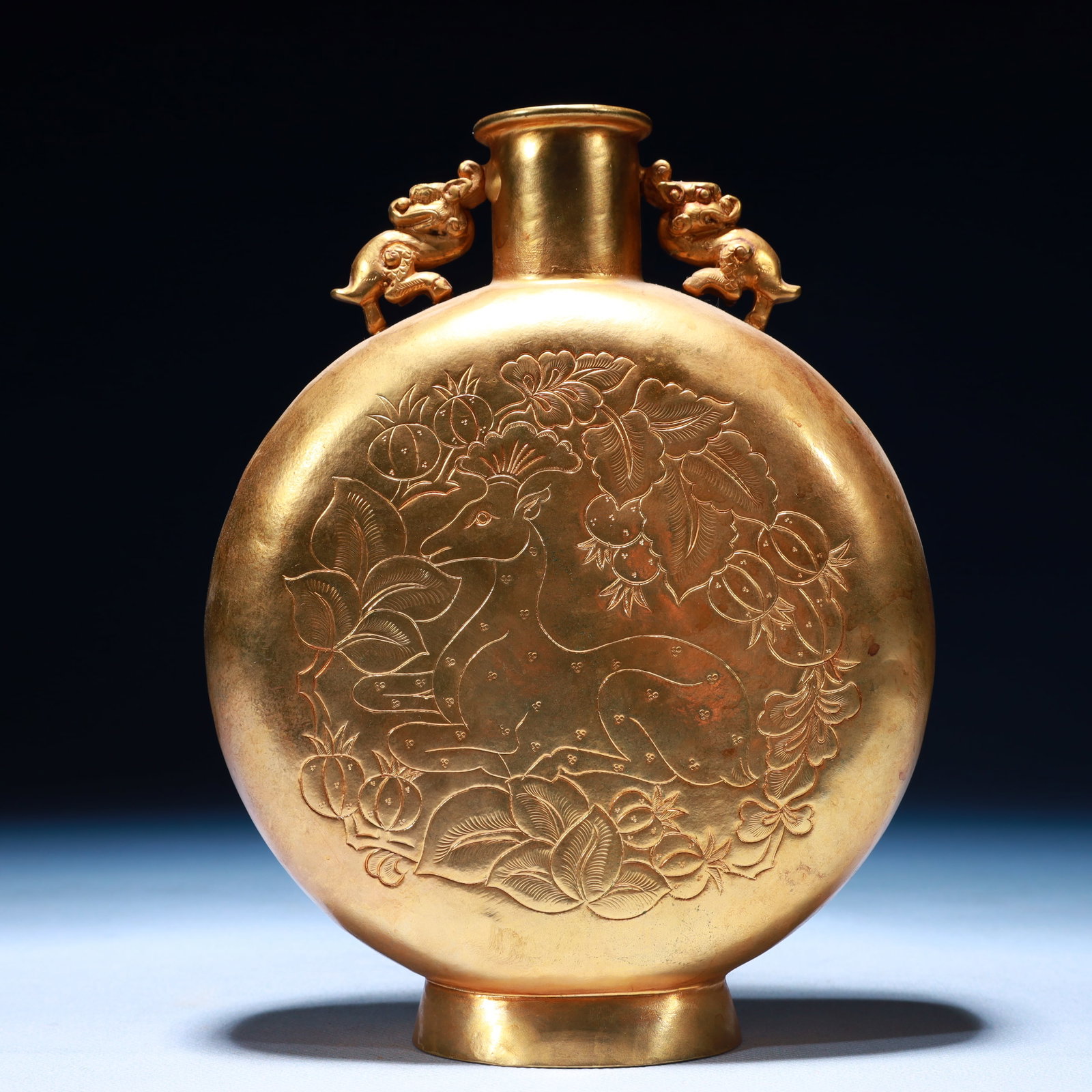 An Exquisite Gilt Bronze Deer Pattern Beast-Ears Pot: An Exquisite Gilt Bronze Deer Pattern Beast-Ears Pot,Tang Dynasty,China,Zhenguan Four-character Mark,Size:5.9inx2.4inx11.4in,Weight:600g 铜鎏金鹿纹兽耳壶