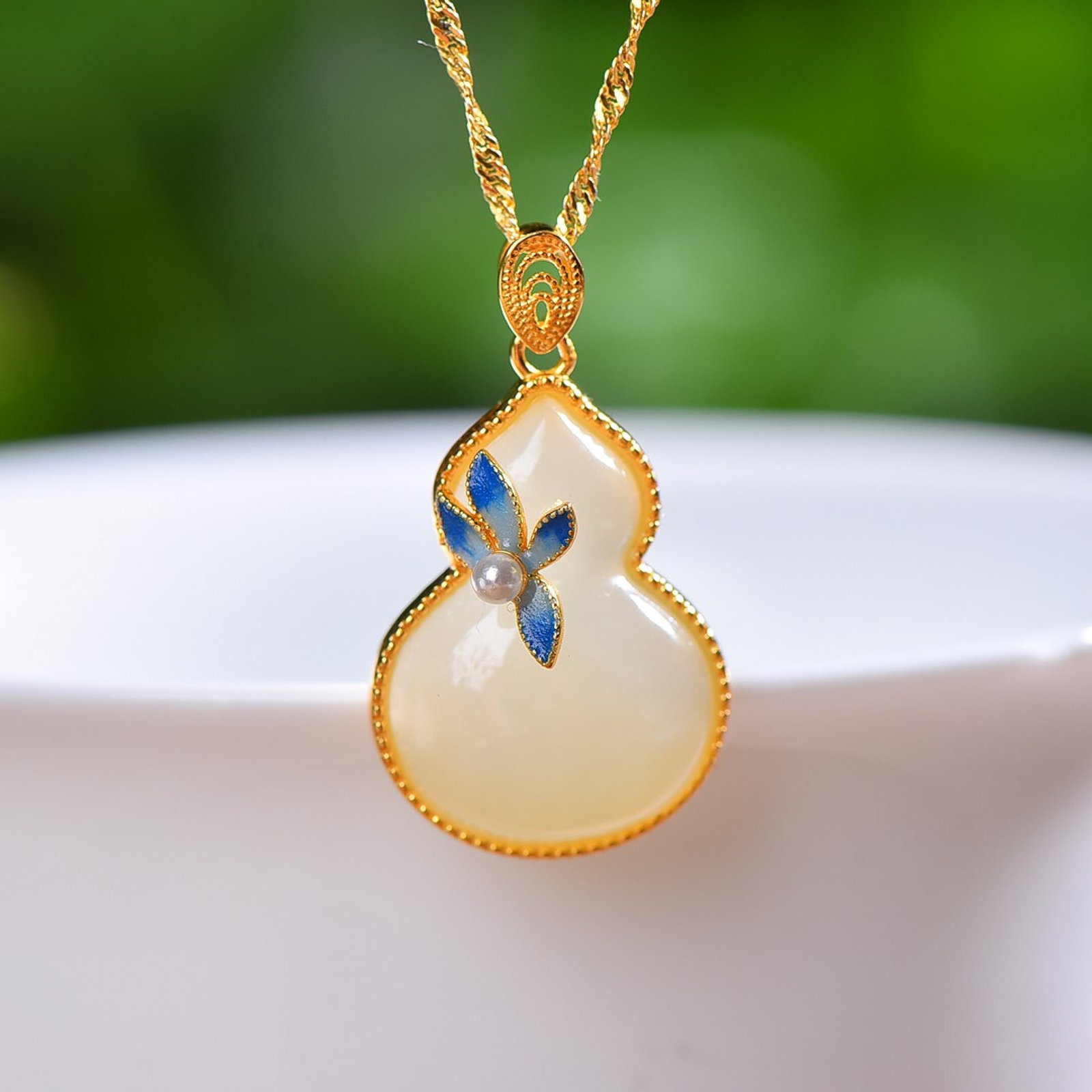 An Exquisite Sterling Silver-Gold Plated Inlaid White Jade Enamel Gourd Pendant: An Exquisite Sterling Silver-Gold Plated Inlaid White Jade Enamel Gourd Pendant,Size:15mmx20mm 纯银镀金镶白玉珐琅葫芦吊坠