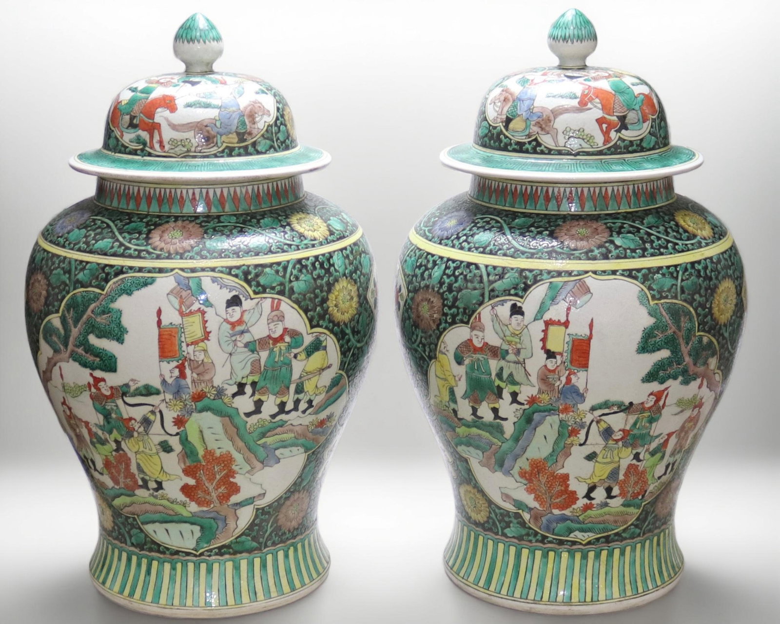 A fine pair of black-ground general jars with reserved figural narrative panels: A fine pair of black-ground general jars with reserved figural narrative panels, Qing Dynasty, China, with six-character Kangxi reign mark, Size:24.3in 一对墨地花卉