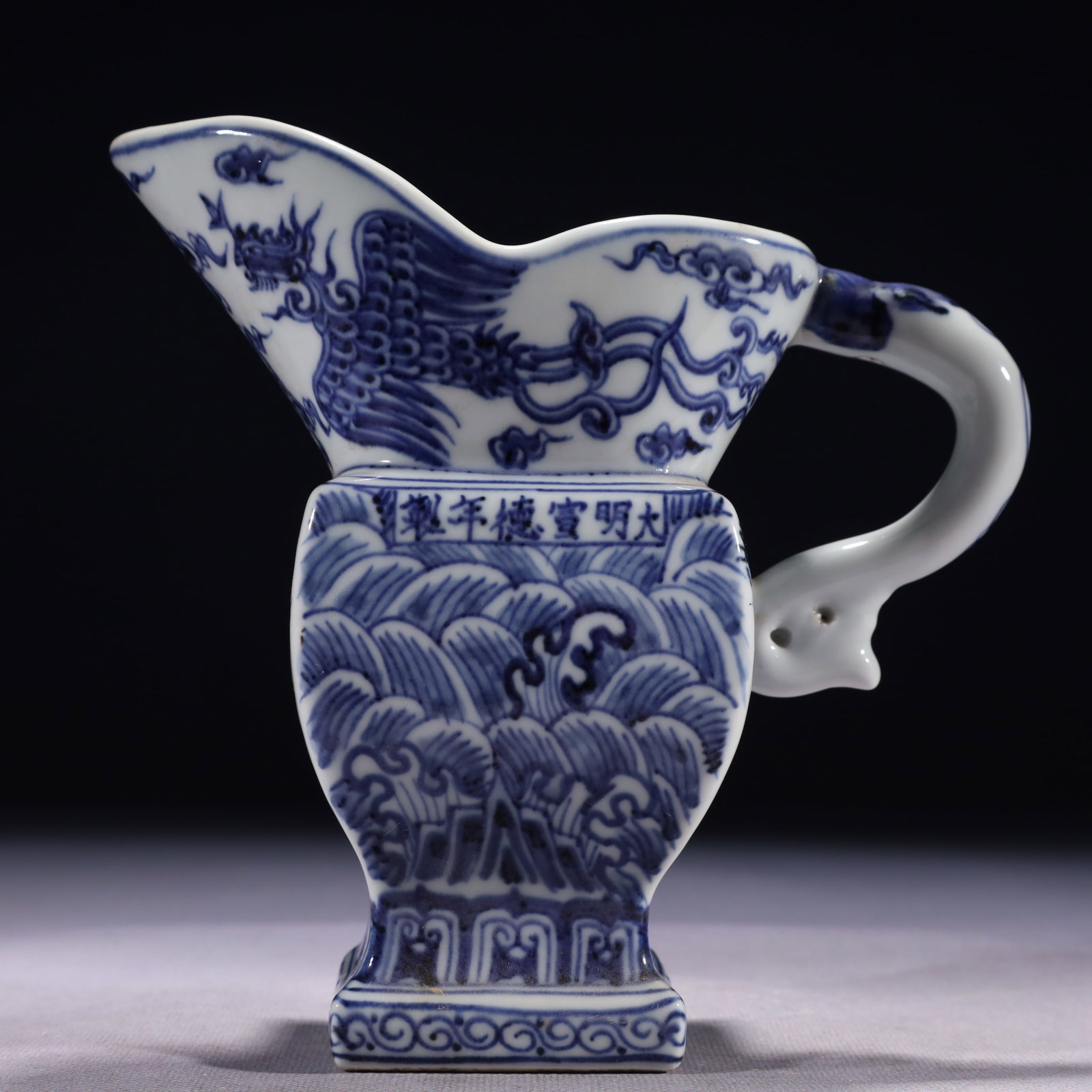 An Exquisite Blue and White Seawater and Phoenix Pattern Goblet: An Exquisite Blue and White Seawater and Phoenix Pattern Goblet,Ming Dynasty,China,Xuande Six-character Mark,Size:6.7inx3.1inx6.7in,Weight:750g 青花海水凤纹爵