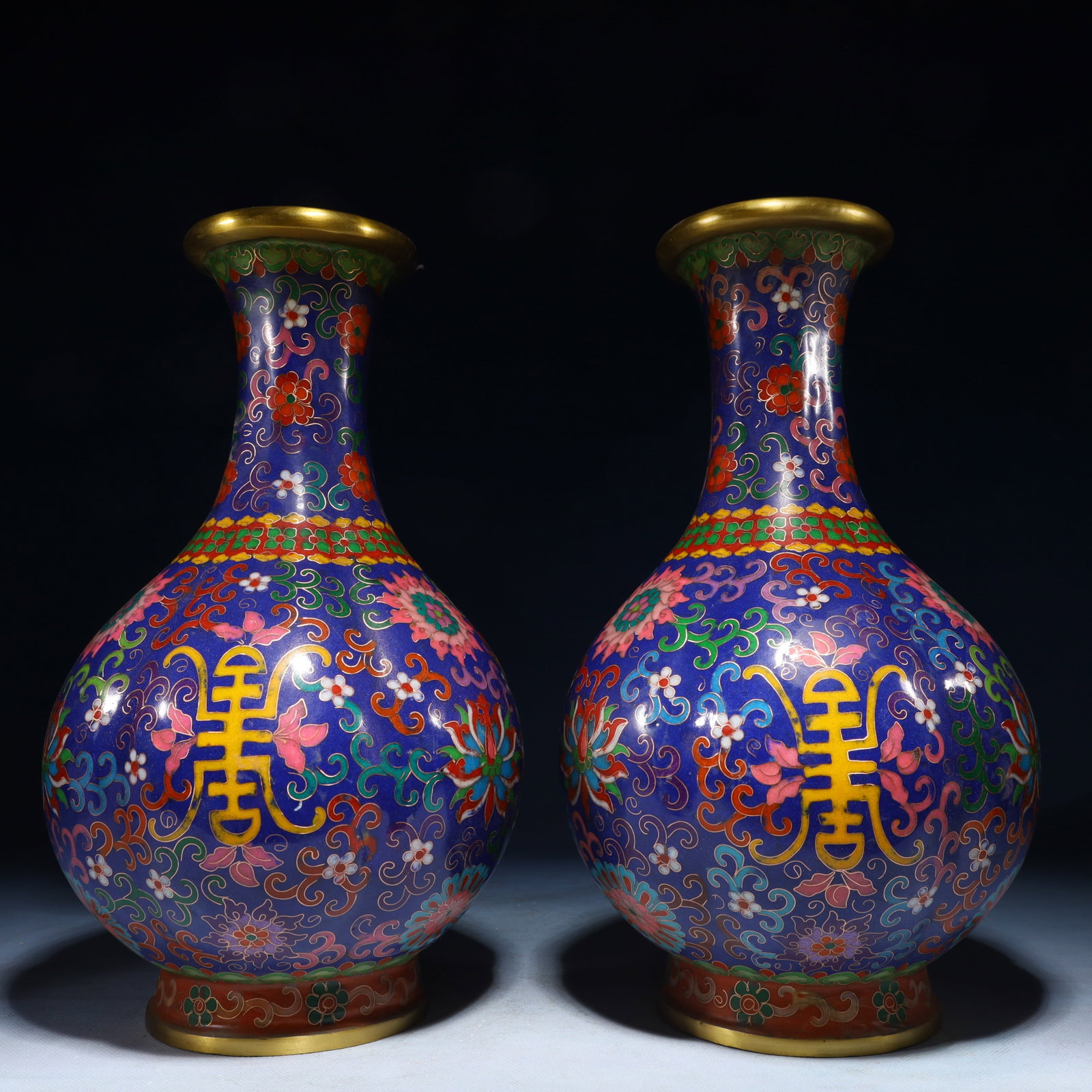 A Pair of Exquisite Cloisonne Lotus Pattern Vases: A Pair of Exquisite Cloisonne Lotus Pattern Vases,Qing Dynasty,China,Qianlong Four-character Mark,Size:7.1inx12.8in,Weight:5850g 一对景泰蓝缠枝莲纹
