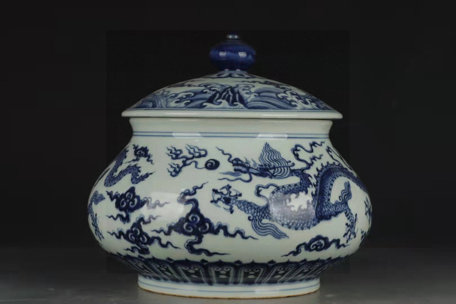 An Exquisite Blue and White Auspicious Cloud and Dragon Pattern Jar with Cover: An Exquisite Blue and White Auspicious Cloud and Dragon Pattern Jar with Cover,Ming Dynasty,China,Xuande Six-character Mark,Size:8.1inx9.4in 青花祥云龙纹盖