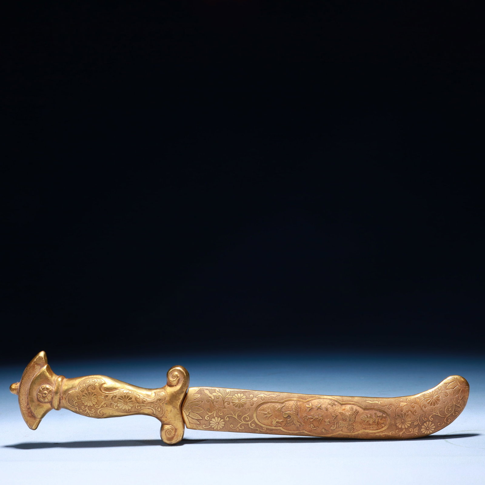An Exquisite Gilt Bronze Flower and Bird Pattern Sword Ornament: An Exquisite Gilt Bronze Flower and Bird Pattern Sword Ornament,Qing Dynasty,China,Size:2inx0.4inx13.4in,Weight:350g 铜鎏金花鸟纹刀摆件,中&#