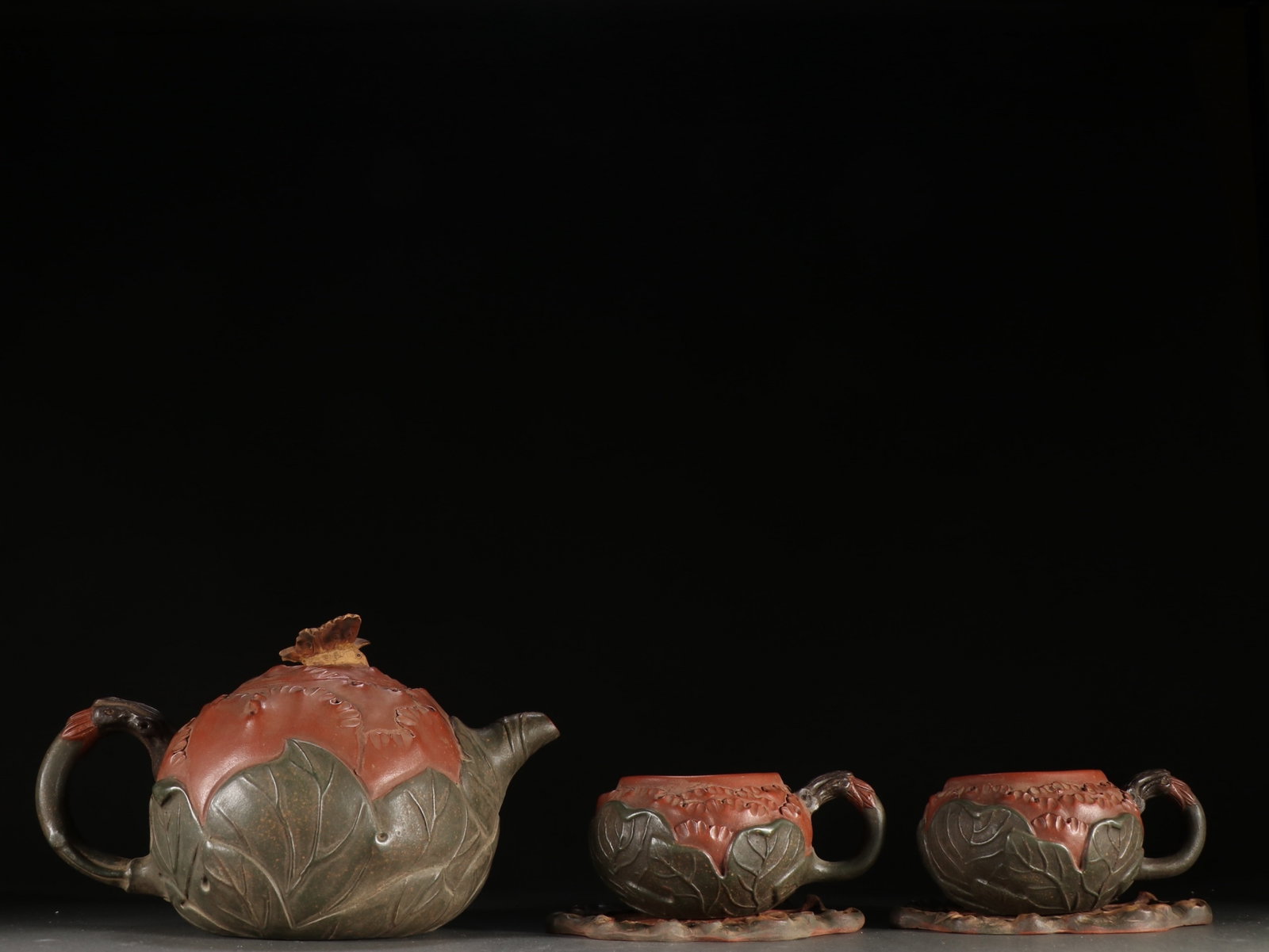 A Set of Rare Purple Sands Peony Pattern Teapots: A Set of Rare Purple Sands Peony Pattern Teapots,Qing Dynasty,China,Jiang Rong Mark,Size:(Teapot)5.1inx7.1in 一套紫砂牡丹纹茶壶,中国&#