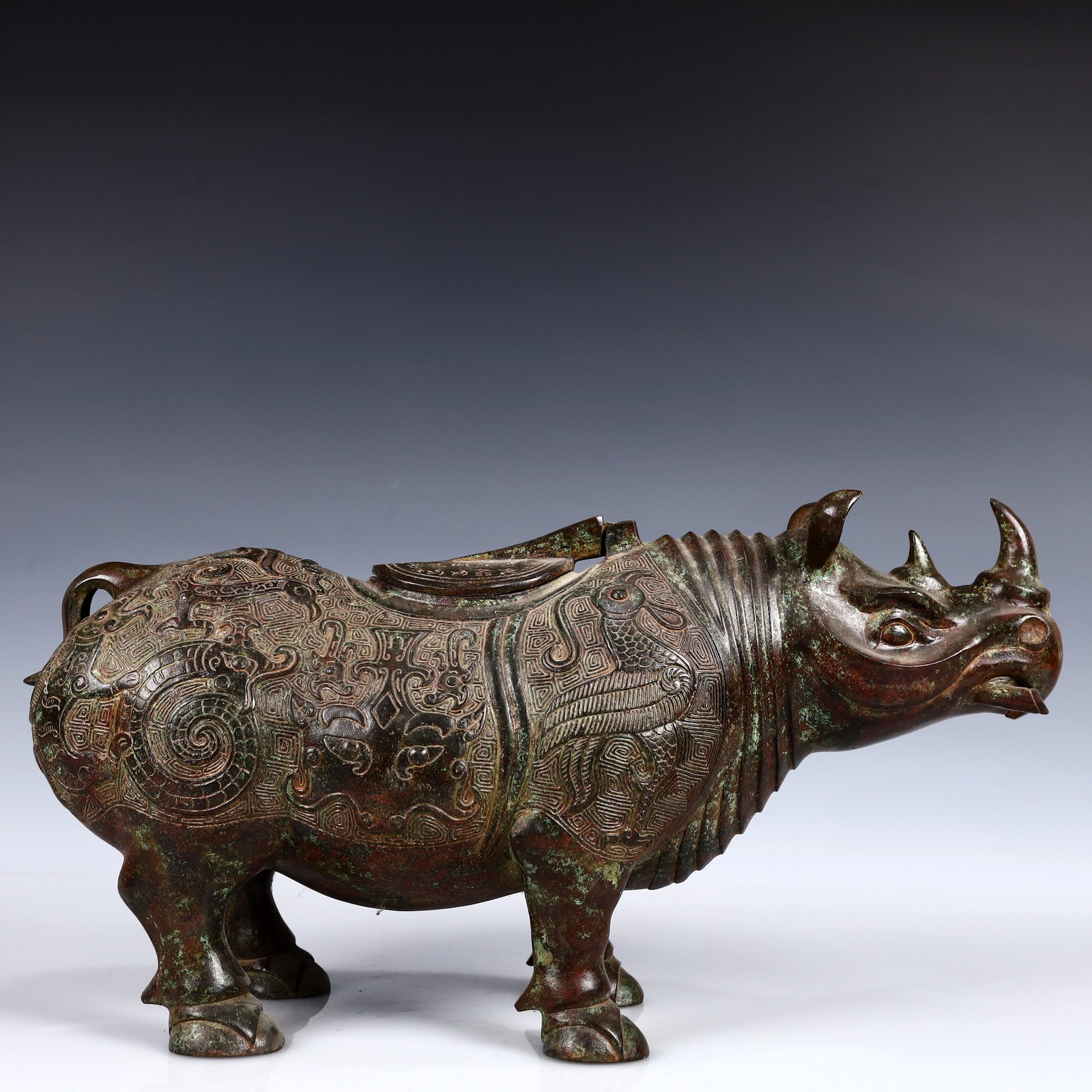 A Rare Bronze Rhinoceros Zun,With Inscription: A Rare Bronze Rhinoceros Zun,With Inscription,W.Zhou,China,Size:16.9inx5.9inx9.1in,Weight:4400g 青铜犀牛尊,带铭文,中国西周ਲ