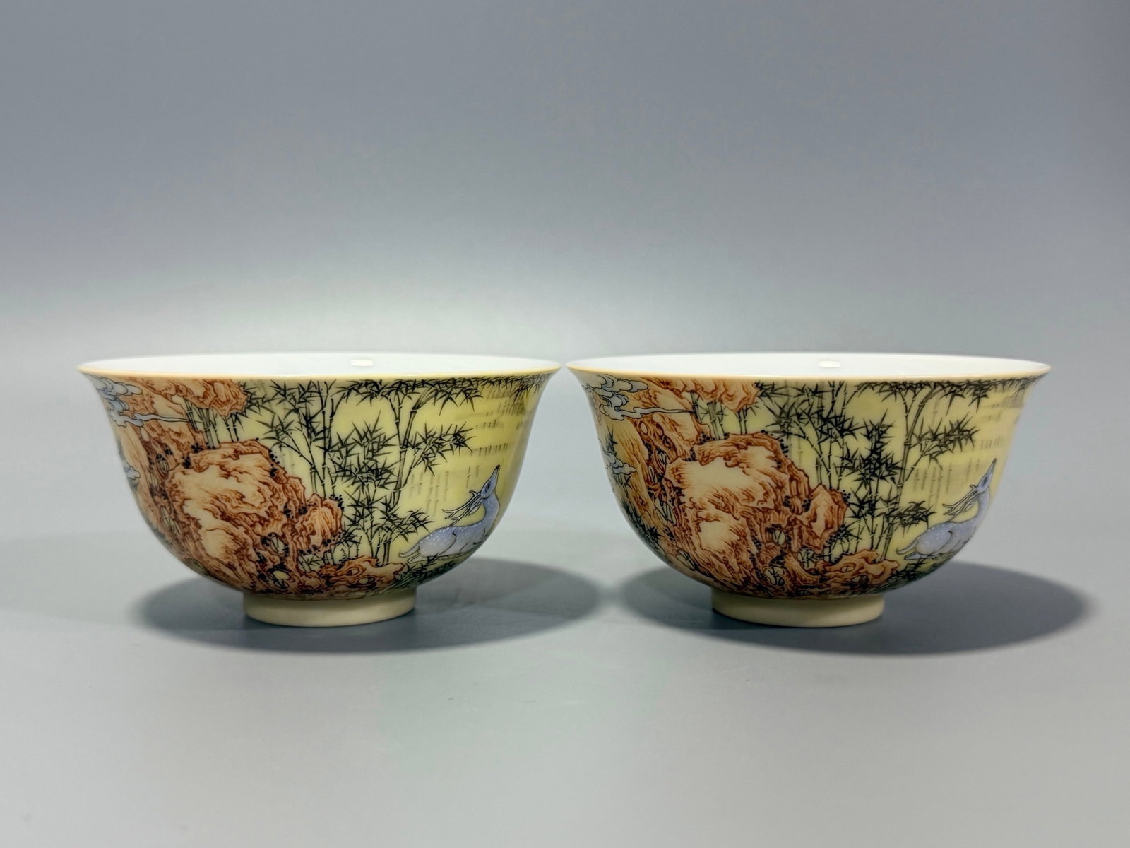 A Pair of Exquisite Yellow Ground Enamel Deer Pattern Cups,with poem: A Pair of Exquisite Yellow Ground Enamel Deer Pattern Cups,with poem,Qing Dynasty,China,Yongzheng Four-character Mark,Size:1.9inx3.4in 一对黄地珐琅彩鹿&