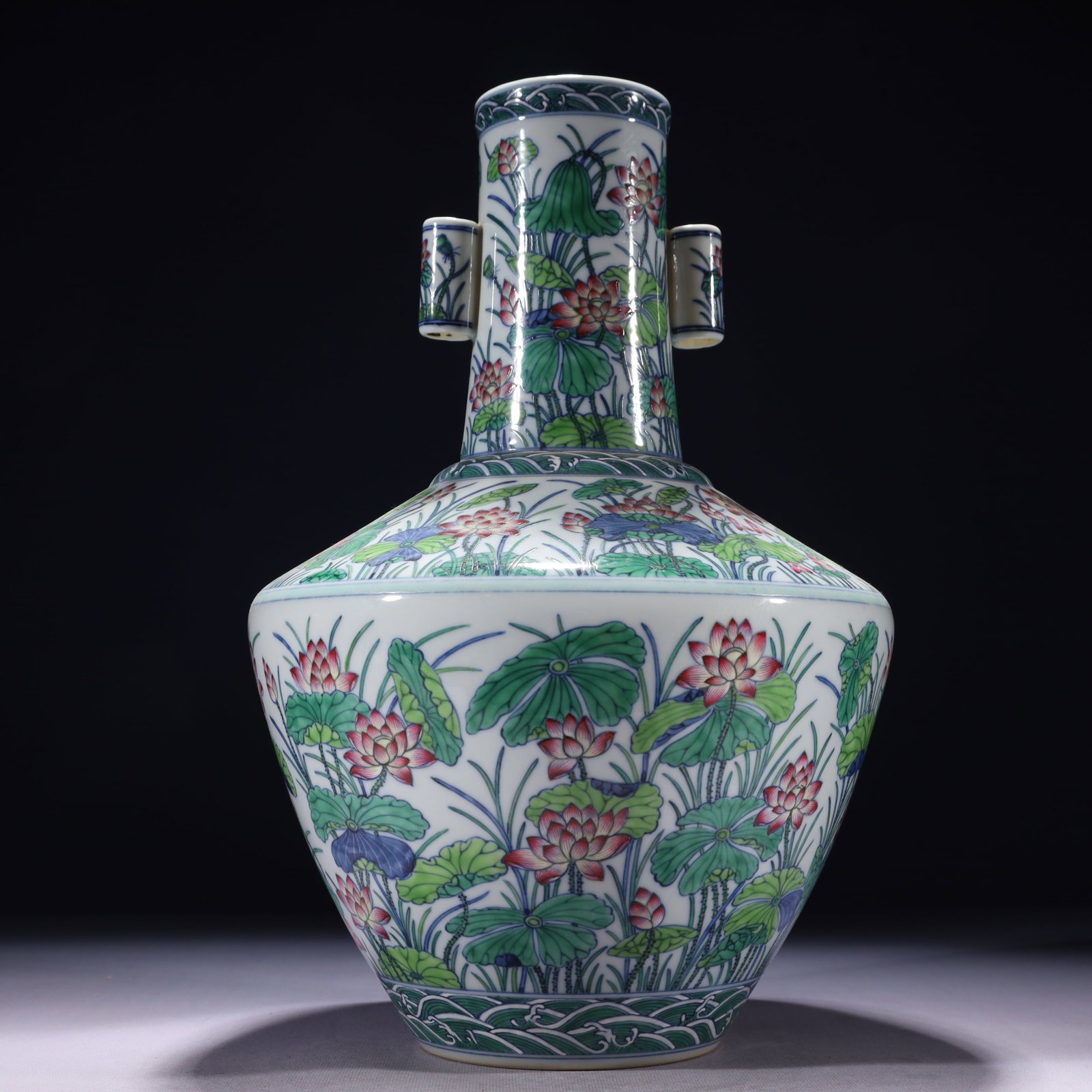 An Exquisite Famille-Rose Lotus Pattern Double-Ears Vase: An Exquisite Famille-Rose Lotus Pattern Double-Ears Vase,Qing Dynasty,China,Qianlong Six-character Mark,Size:9.4inx15.4in,Weight:3300g 粉彩荷花纹双耳瓶,
