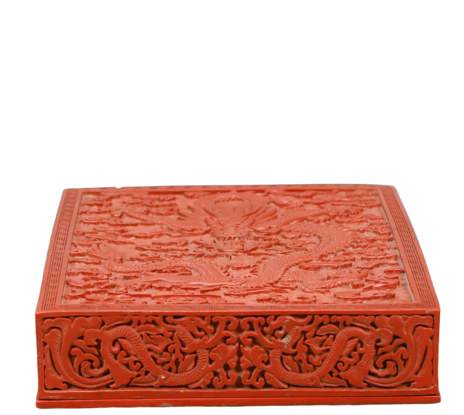 A Craved Red Lacquer Auspicious Cloud and Dragon Pattern Box: A Craved Red Lacquer Auspicious Cloud and Dragon Pattern Box,Qing Dynasty,China,Siize:12.4inx9.8inx3in 剔红漆祥云龙纹盒,中国清代