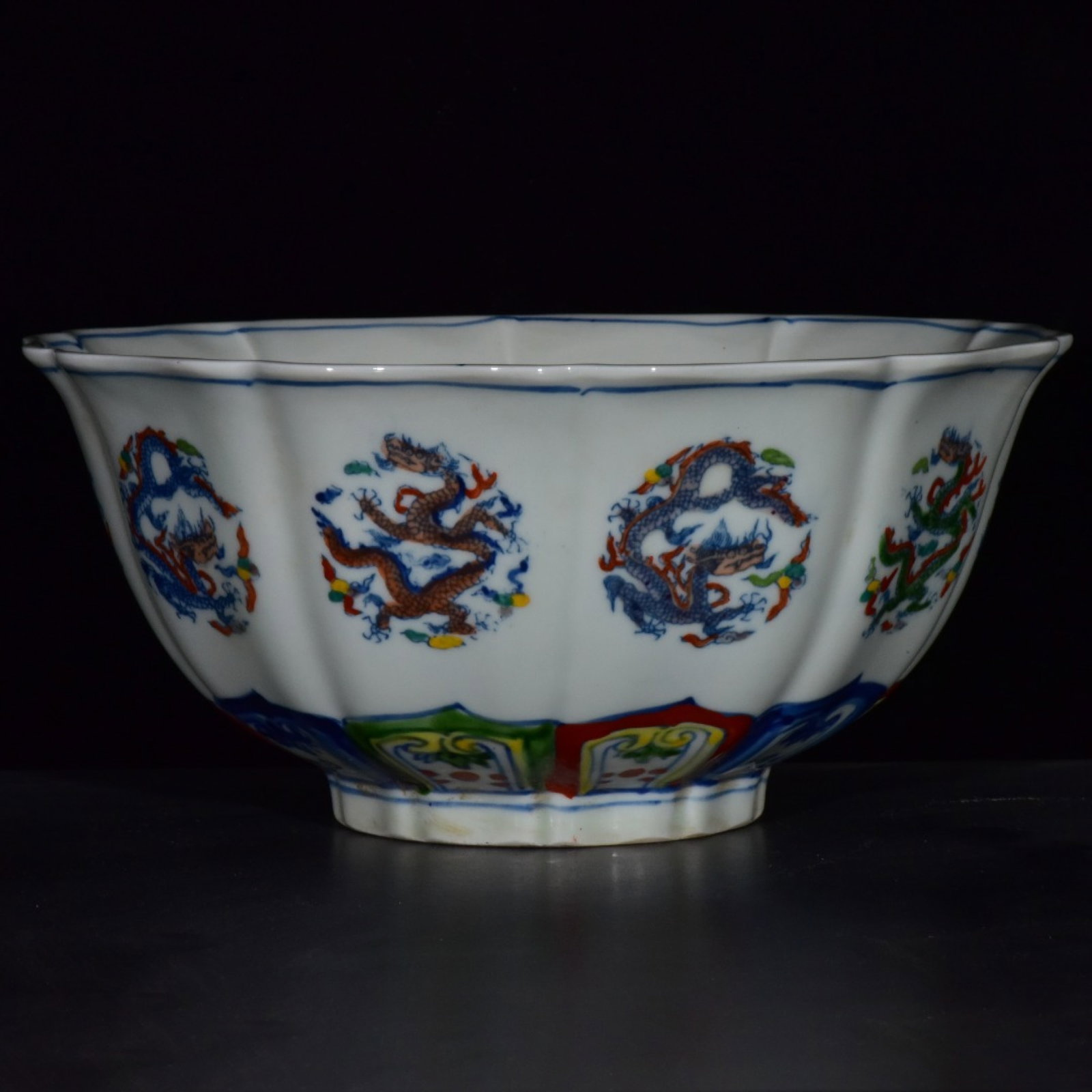 An Exquisite Doucai Auspicious Cloud and Dragon Pattern Bowl: An Exquisite Doucai Auspicious Cloud and Dragon Pattern Bowl,Ming Dynasty,China,Xuande Six-character Mark,Size:4.1inx8.9in 斗彩祥云龙纹碗,中国