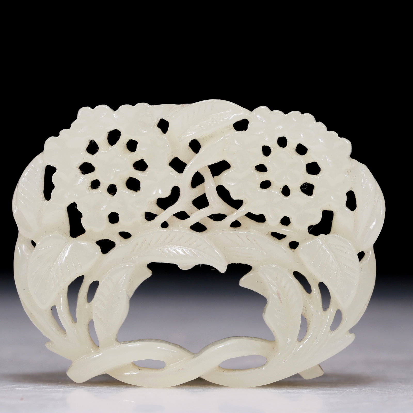 An Excellent White Jade 'Flower' Pendant: An Excellent White Jade 'Flower' Pendant. Pierced with leafy flowers bearing on elongated stalks. Chinese Qing Dynasty. Size:2.4inx1.8inx0.2in. Weight:37.9g 清代 白玉花&#