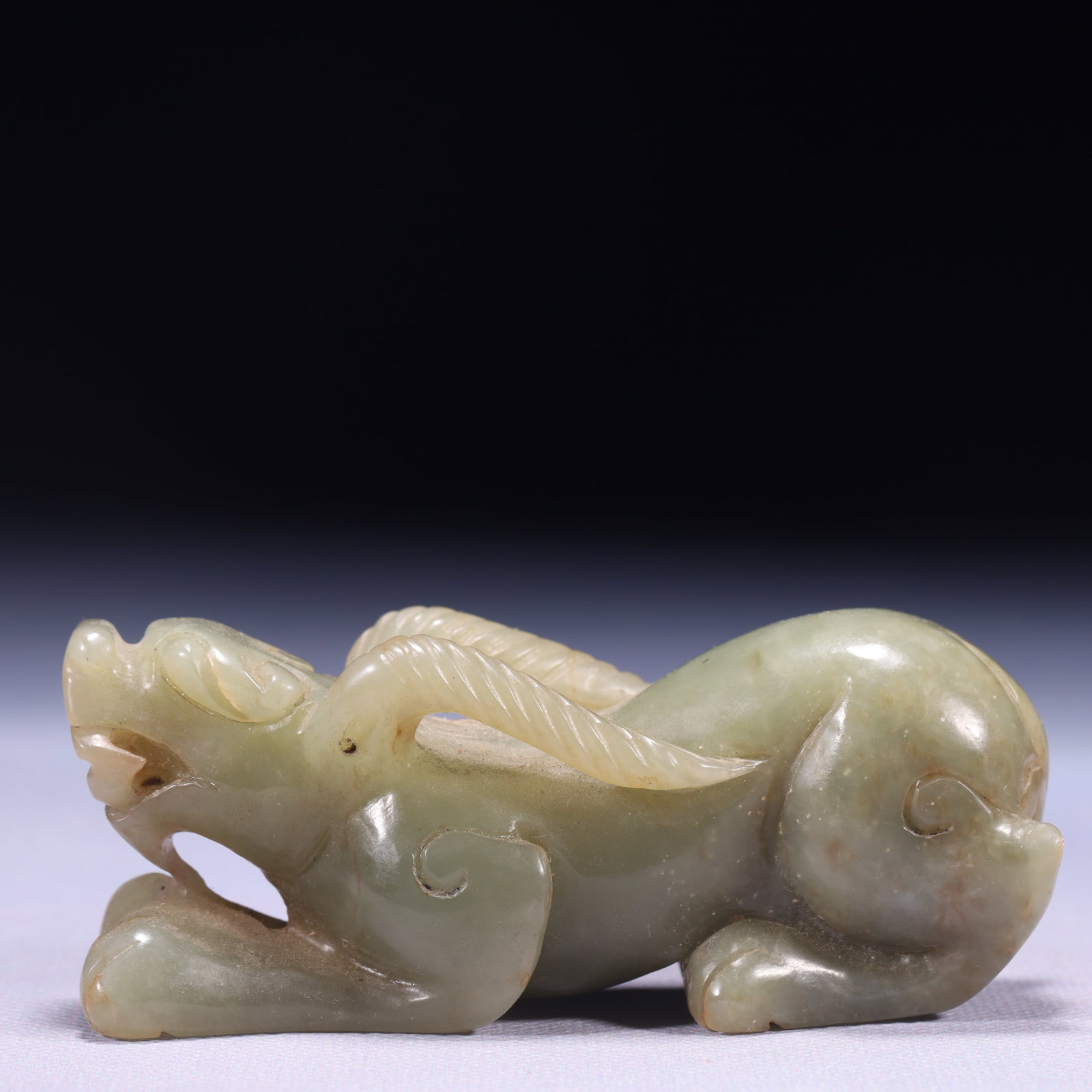 An Exquisite Green Jade Beast Ornament: An Exquisite Green Jade Beast Ornament,Qing Dynasty,China,Size:3.5inx1.2inx1.4in,Weight:206g 青玉兽摆件,中国清代