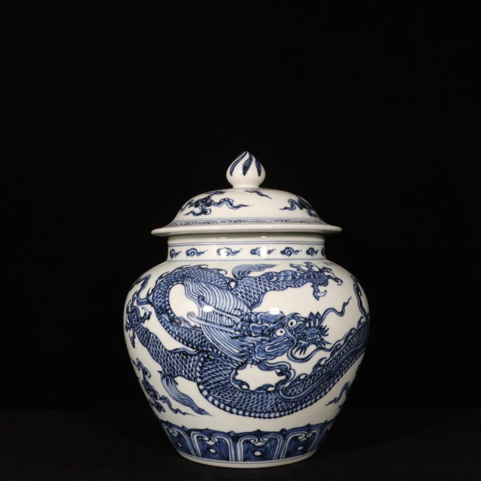 An Exquisite Blue and White Auspicious Cloud and Dragon Pattern Jar with Cover: An Exquisite Blue and White Auspicious Cloud and Dragon Pattern Jar with Cover,Ming Dynasty,China,Xuande Six-character Mark,Size:11.4inx9.1in 青花祥云龙纹盖&#