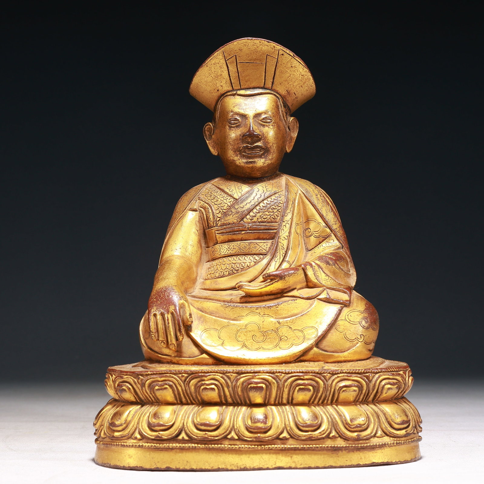 A Solemn Gilt Bronze Auspicious Cloud Pattern Buddha Statue,With Inscription: A Solemn Gilt Bronze Auspicious Cloud Pattern Buddha Statue,With Inscription,Qing Dynasty,China,Size:6.7inx5.1inx10.2in,Weight:3900g 铜鎏金祥云纹佛像,&#