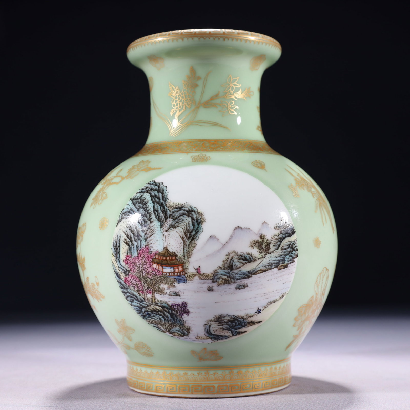 An Exquisite Celadon Glazed Enamel Painted Gold Landscape Pattern Vase: An Exquisite Celadon Glazed Enamel Painted Gold Landscape Pattern Vase,Qing Dynasty,China,Qianlong Four-character Mark,Size:5.5inx8.3in,Weight:1000g 青釉珐琅彩描