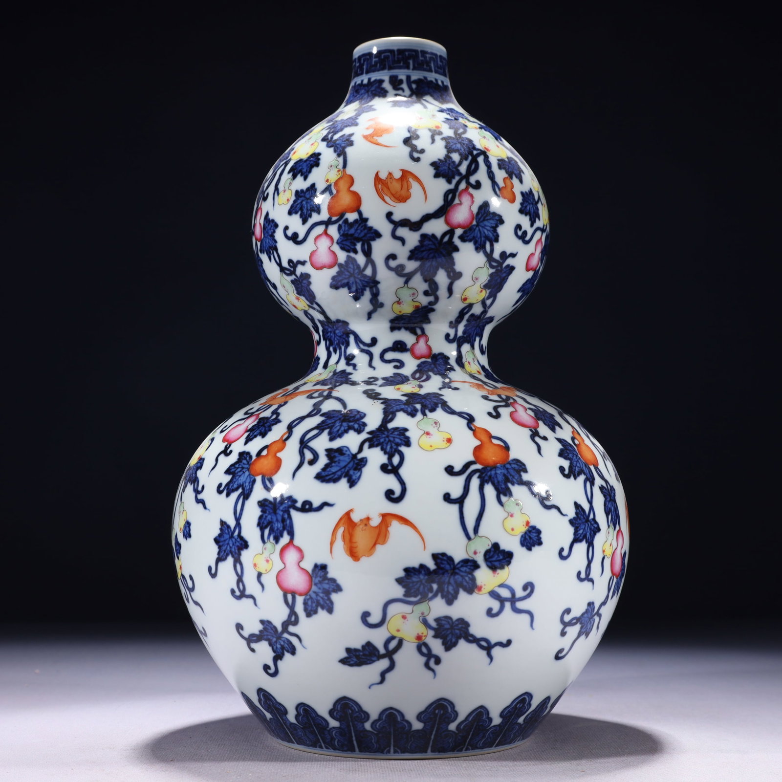 An Exquisite Blue and White Iron-Red Painted Gold Bats and Groud Pattern Gourd-Shaped Vase: An Exquisite Blue and White Iron-Red Painted Gold Bats and Groud Pattern Gourd-Shaped Vase,Qing Dynasty,China,Qianlong Six-character Mark,Size:7.1inx12.6in,Weight:2250g 青花矾红