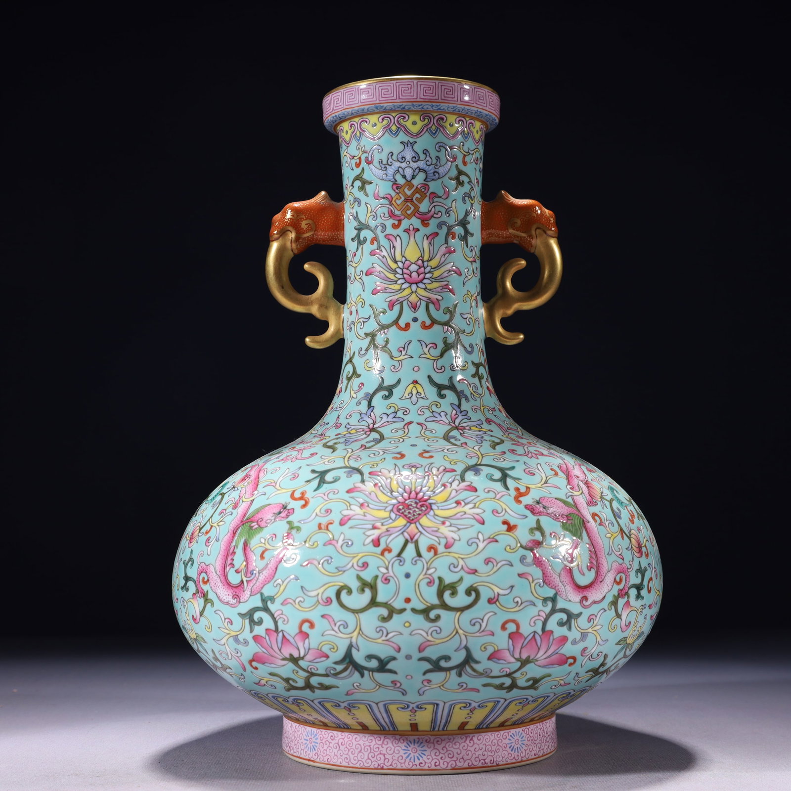 An Exquisite Turquoise Glazed Famille-Rose Painted Gold Lotus and Dragon Pattern Double-Ears Vase: An Exquisite Turquoise Glazed Famille-Rose Painted Gold Lotus and Dragon Pattern Double-Ears Vase,Qing Dynasty,China,Qianlong Six-character Mark,Size:7.5inx12.2in,Weight:2350g 松石绿