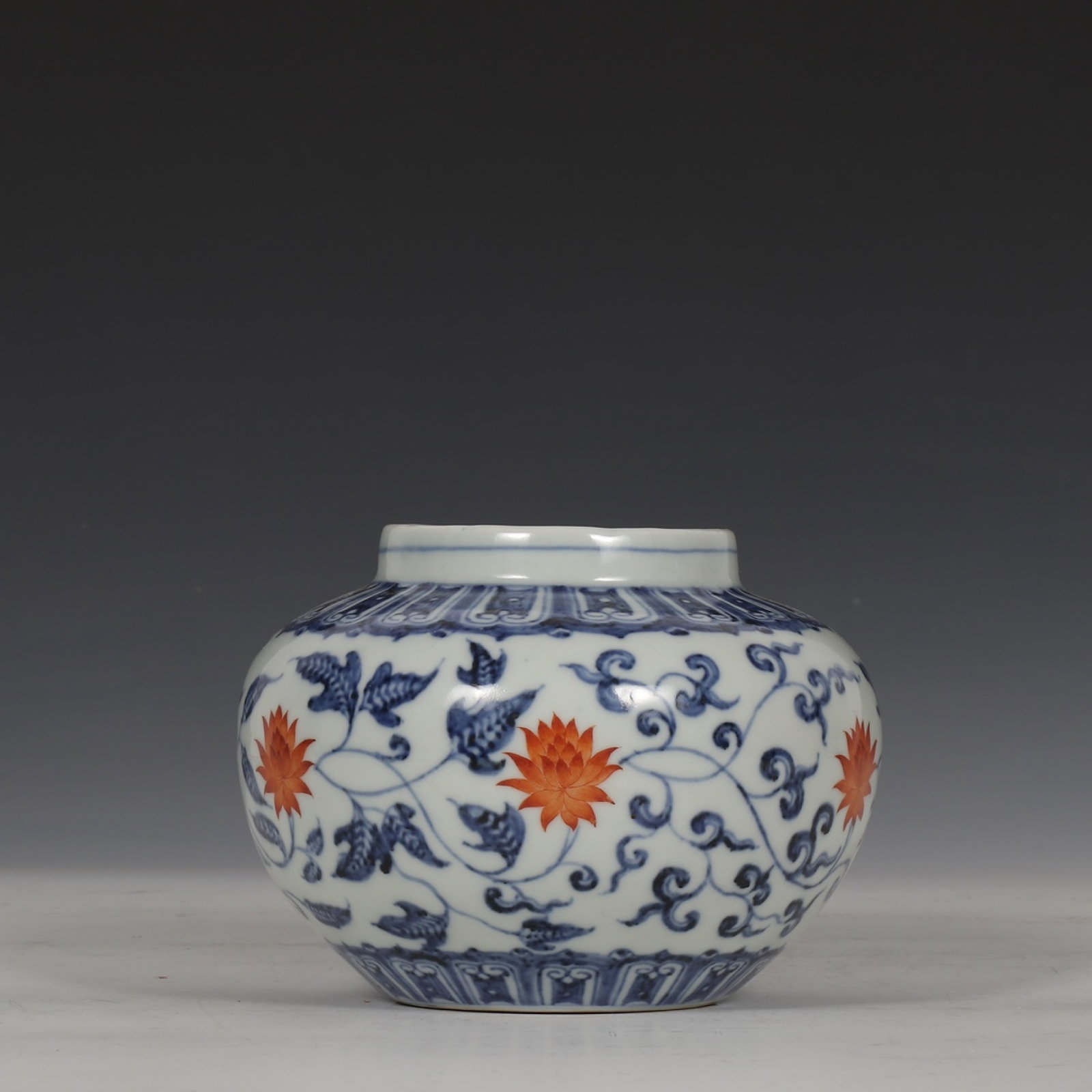 An Exquisite Blue and White Iron-Red Lotus Pattern Jar: An Exquisite Blue and White Iron-Red Lotus Pattern Jar,Ming Dynasty,China,Xuande Six-character Mark,Size:4.6inx6.1in 青花矾红缠枝莲纹罐,中&#
