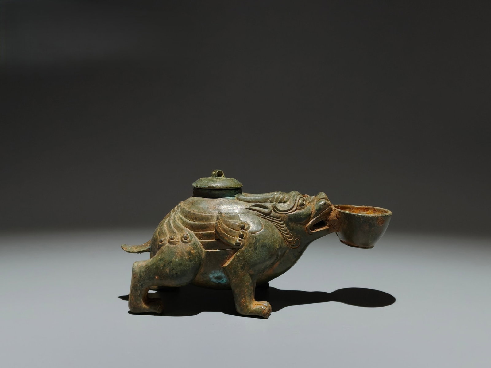 An Archaic Bronze Beast Ornament: An Archaic Bronze Beast Ornament,Han Dynasty,China,Size:3.5inx6.7inx3.5in 青铜兽摆件,中国汉代