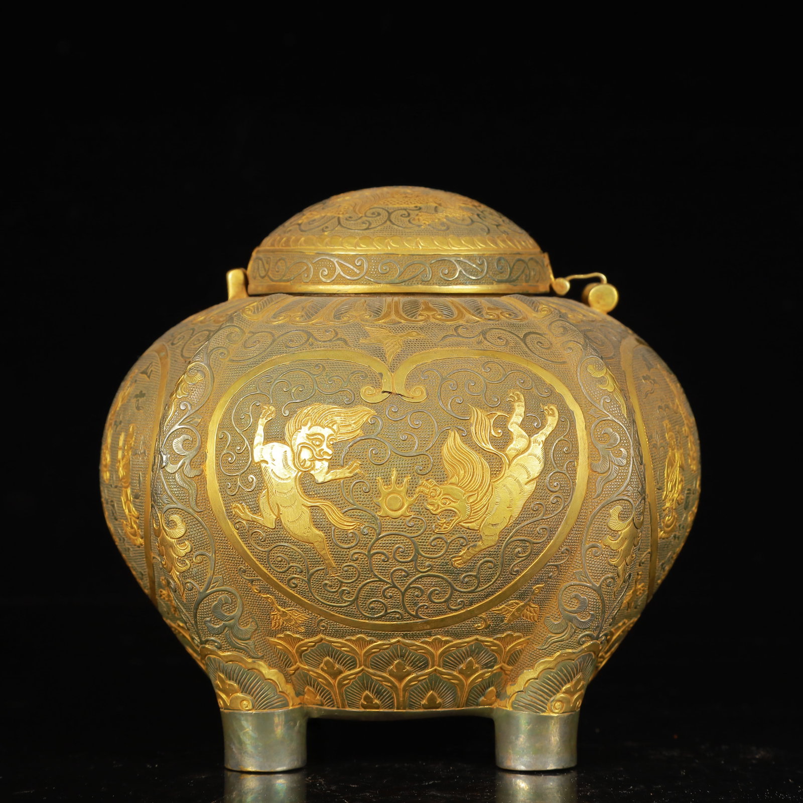 An Exquisite Gilt Silver Figure and Auspicious Beast Pattern Four Legs Cover Jar: An Exquisite Gilt Silver Figure and Auspicious Beast Pattern Four Legs Cover Jar,Tang Dynasty,China,Zhenguan Four-Character Mark,Size:5.5inx4.7inx5.1in,Weight:1000g 银鎏金人