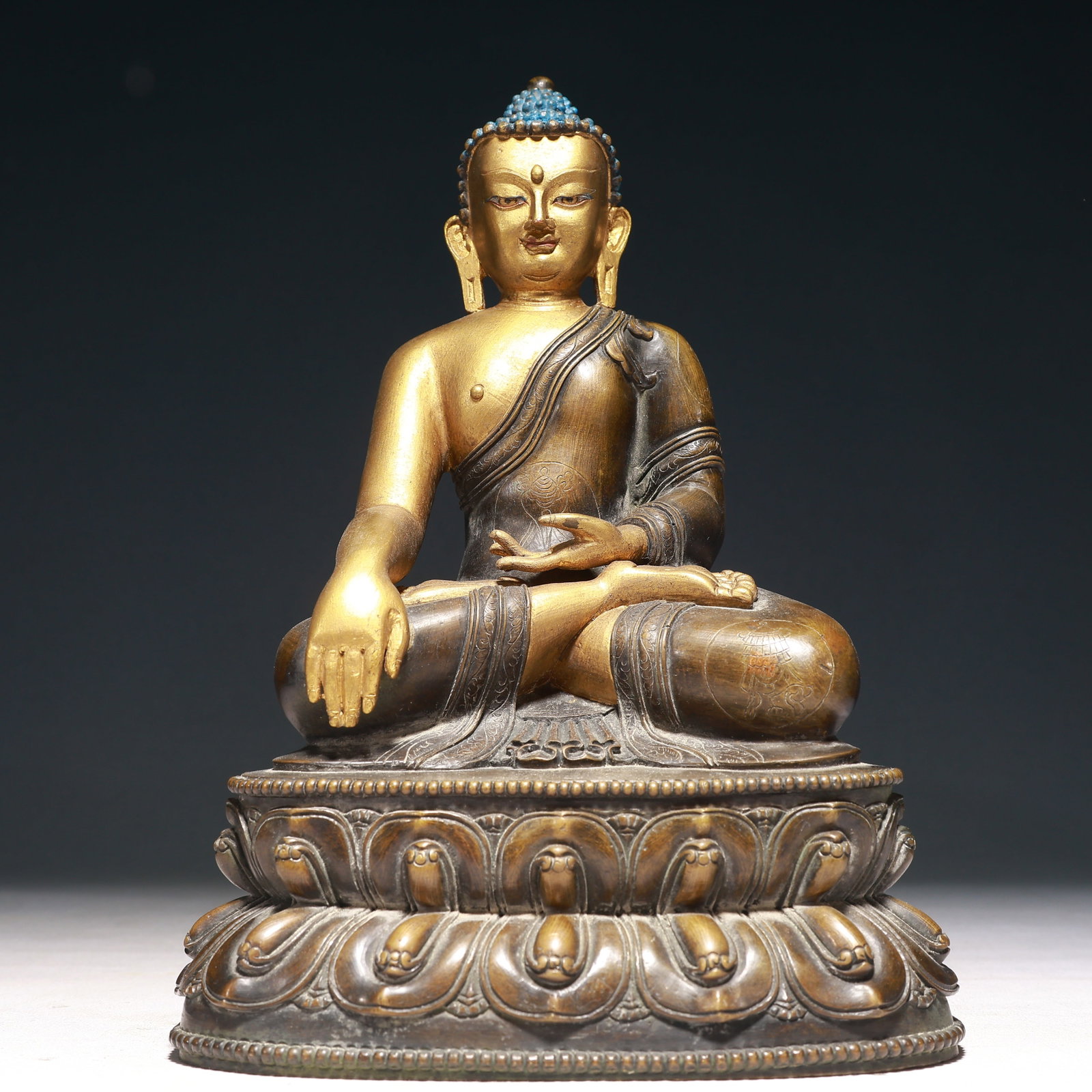 A Solemn Gilt Bronze Statue of Sakyamuni: A Solemn Gilt Bronze Statue of Sakyamuni,Ming Dynasty,China,Yongle Six-character Mark,Size:7.5inx5.3inx10.6in,Weight:4100g 铜鎏金释迦摩尼像,中