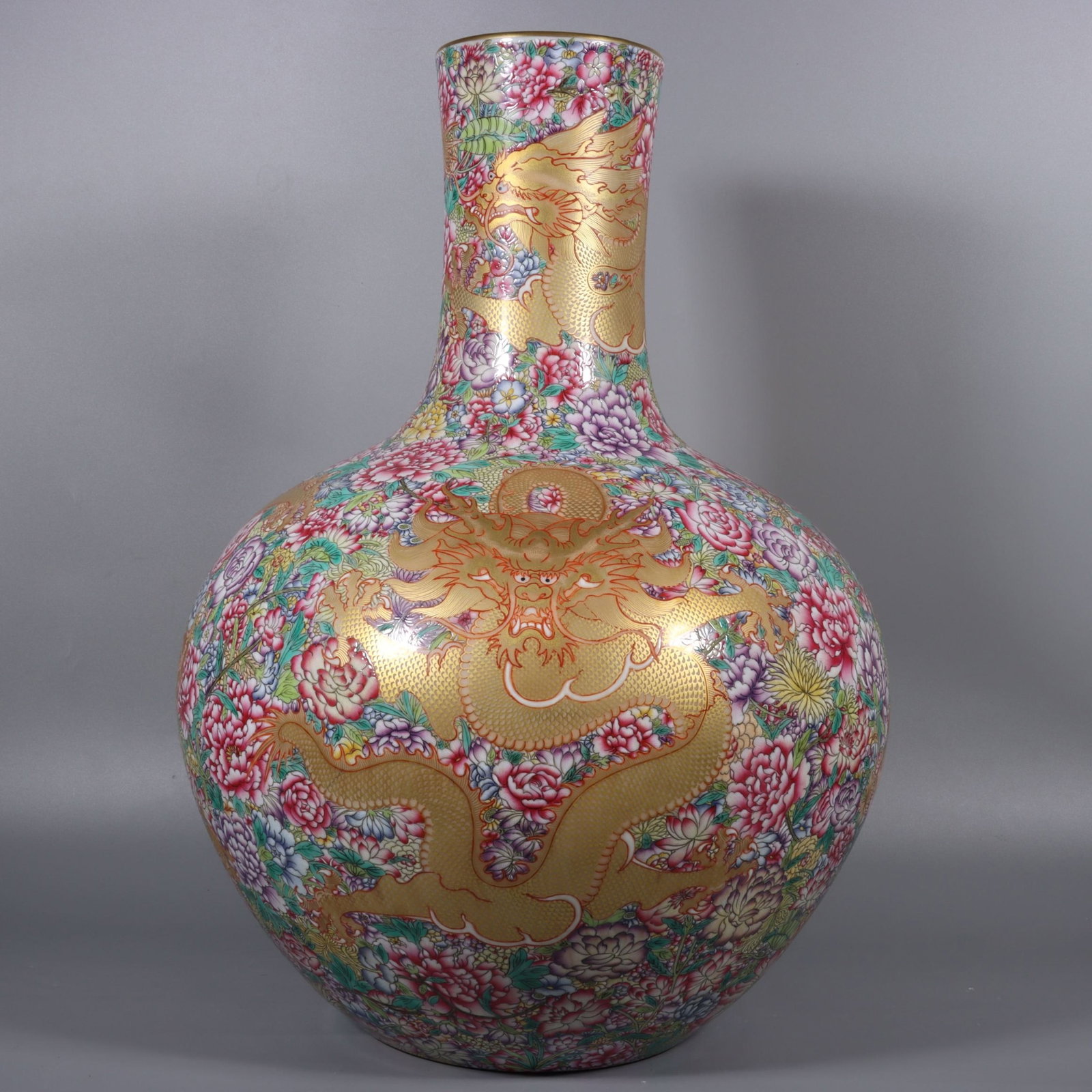 A Huge Famille-Rose Painted Gold Flower and Dragon Pattern Vase: A Huge Famille-Rose Painted Gold Flower and Dragon Pattern Vase,Qing Dynasty,China,Qianlong Six-character Mark,Size:20.3inx7.1in 粉彩描金花卉龙纹瓶