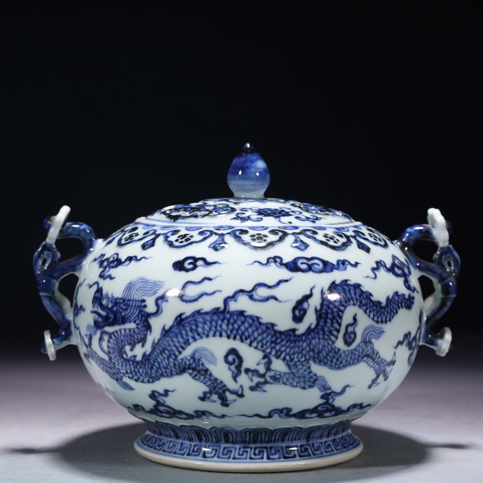 An Exquisite Blue and White Auspicious Cloud and Dragon Pattern Double-Ears Jar with Cover: An Exquisite Blue and White Auspicious Cloud and Dragon Pattern Double-Ears Jar with Cover,Ming Dynasty,China,Xuande Six-character Mark,Size:7.9inx5.9inx5.9in,Weight:1050g