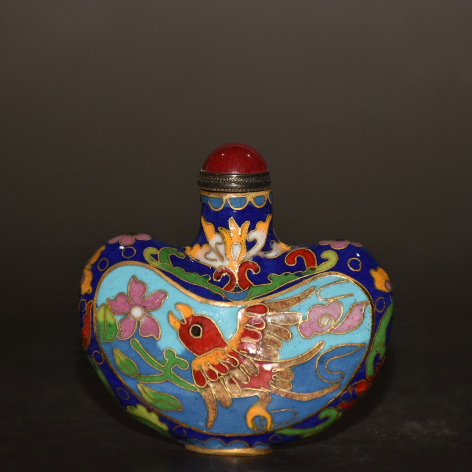 An Exquisite Painted Enamel Flower and Bird Pattern Snuff Bottle: An Exquisite Painted Enamel Flower and Bird Pattern Snuff Bottle,Qing Dynasty,China,Size:3inx1inx3in,Weight:80g 画珐琅花鸟纹鼻烟壶,中国