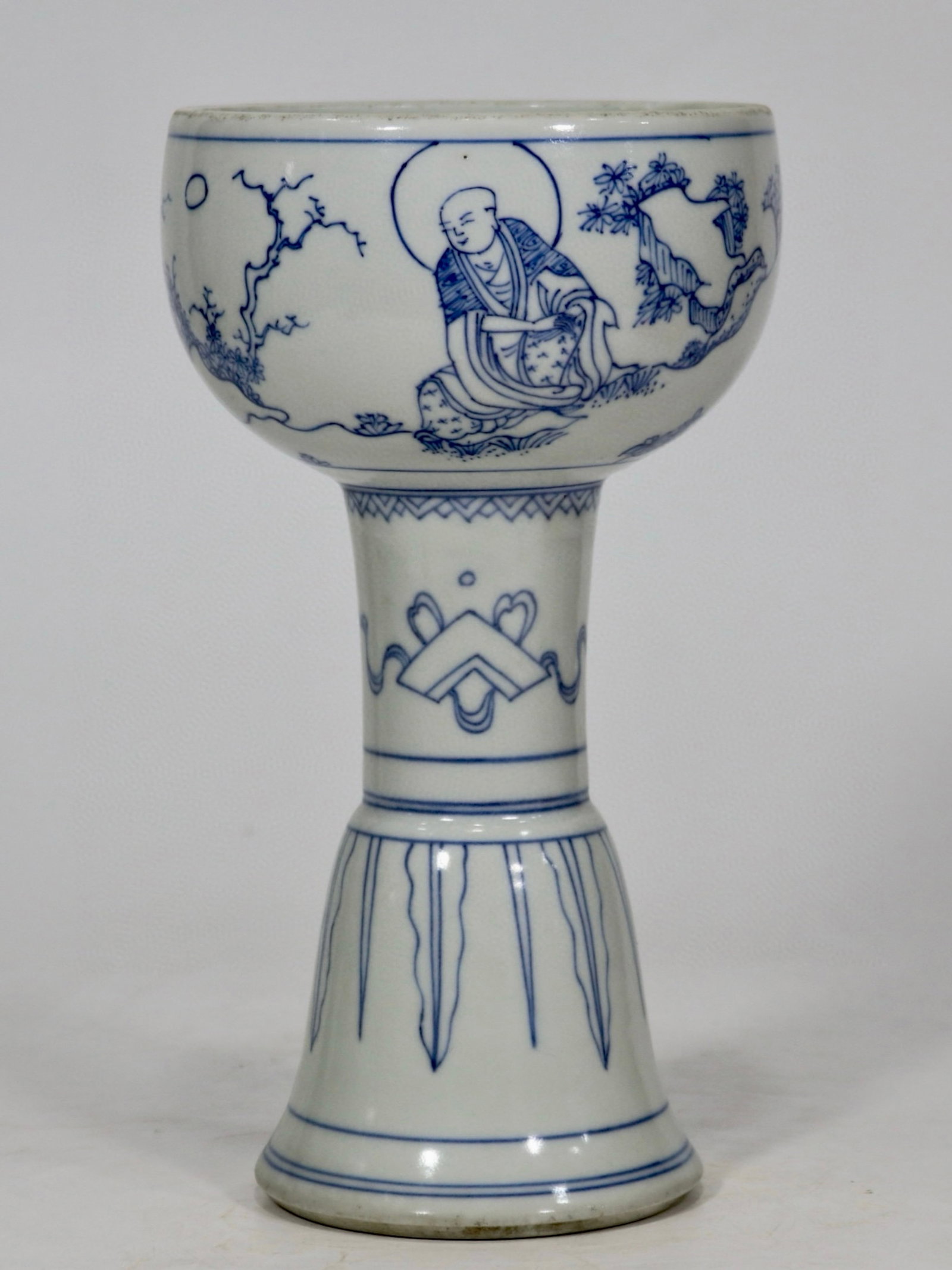 A fine blue and white lightly outlined figural stem cup: A fine blue and white lightly outlined figural stem cup, Ming Dynasty, China, with six-character Chongzhen reign mark, Size:8.3inx4.5inA fine blue and white lightly outlined figural stem cup, Ming Dyn