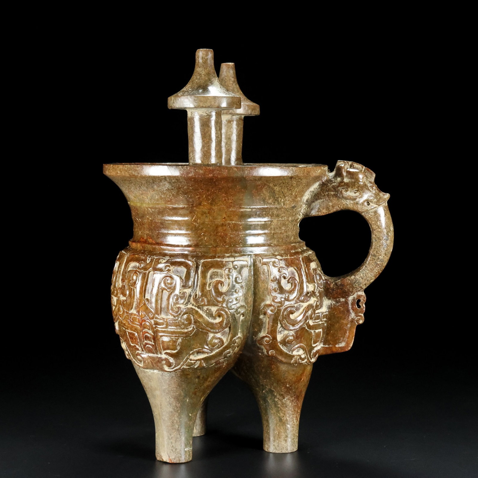 An Exquisite Archaic Jade Beast-Face Pattern Tripod Cup: An Exquisite Archaic Jade Beast-Face Pattern Tripod Cup,Ancient Time,China,Size:8.8inx6.5inx4.9in,Weight:1837g 高古玉兽面纹三足杯子,中