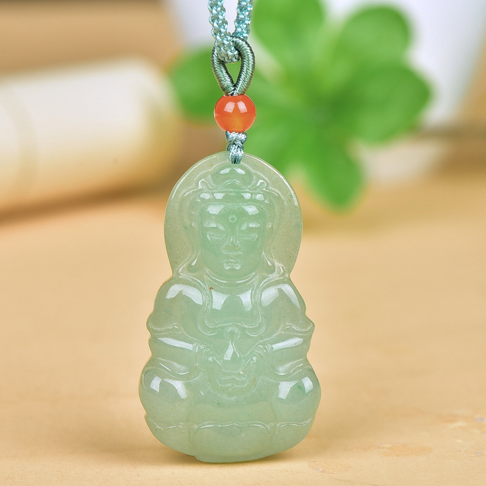An Exquisite Greenish Jade Statue of Avalokitesvara Pendant: An Exquisite Greenish Jade Statue of Avalokitesvara Pendant,Size:27mmx45mm 青玉观音挂件