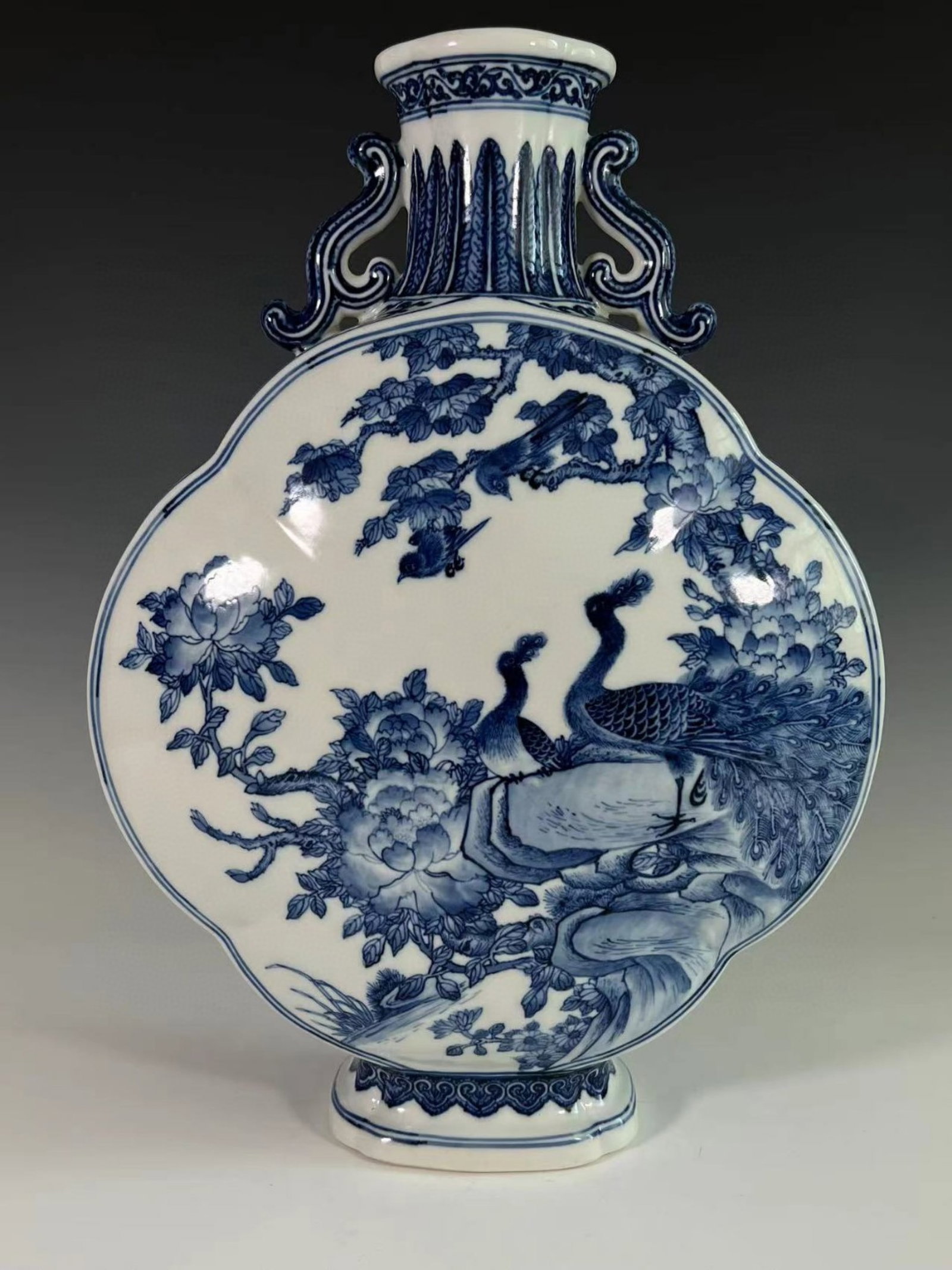 A Huge Blue and White Flower and Peacock Pattern Double-Ears Vase: A Huge Blue and White Flower and Peacock Pattern Double-Ears Vase,Qing Dynasty,China,Qianlong Six-character Mark,Size:15.9inx4.8in 青花花卉孔雀纹双ň