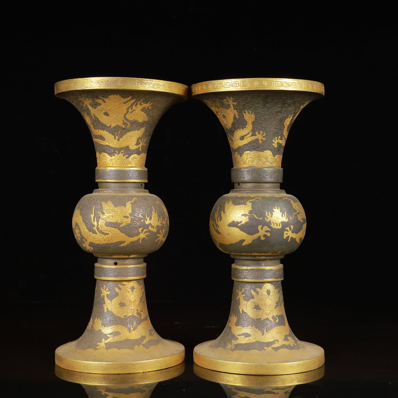A Pair of Exquisite Gilt Silver Dragon Pattern Vases: A Pair of Exquisite Gilt Silver Dragon Pattern Vases,Tang Dynasty,China,Zhenguan Four-Character Mark,Size:5.5inx11in*2,Weight:2750g