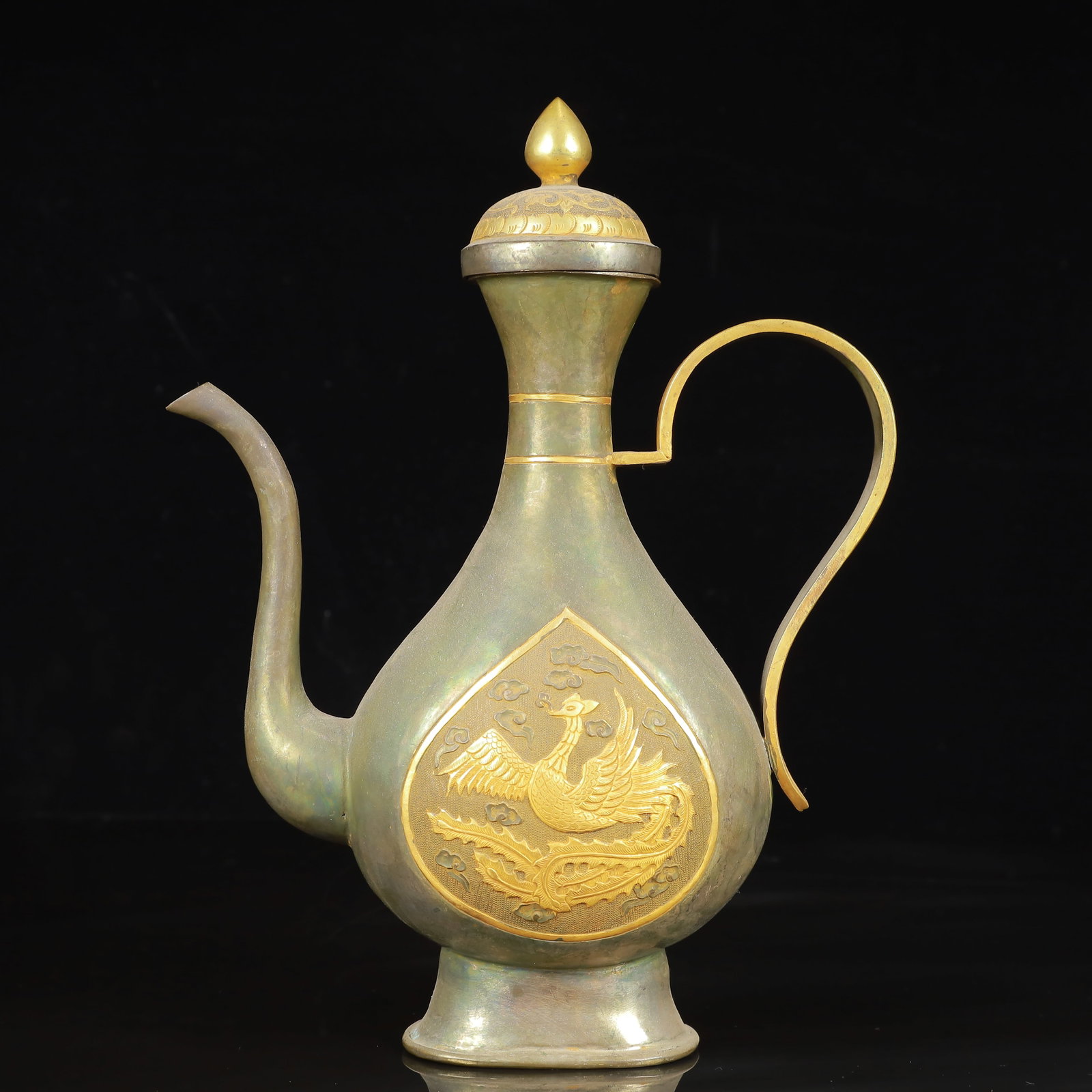 An Exquisite Gilt Silver Phoenix Pattern Ewer: An Exquisite Gilt Silver Phoenix Pattern Ewer,Tang Dynasty,China,Zhenguan Four-Character Mark,Size:7.9inx3.1inx10.2in,Weight:650g