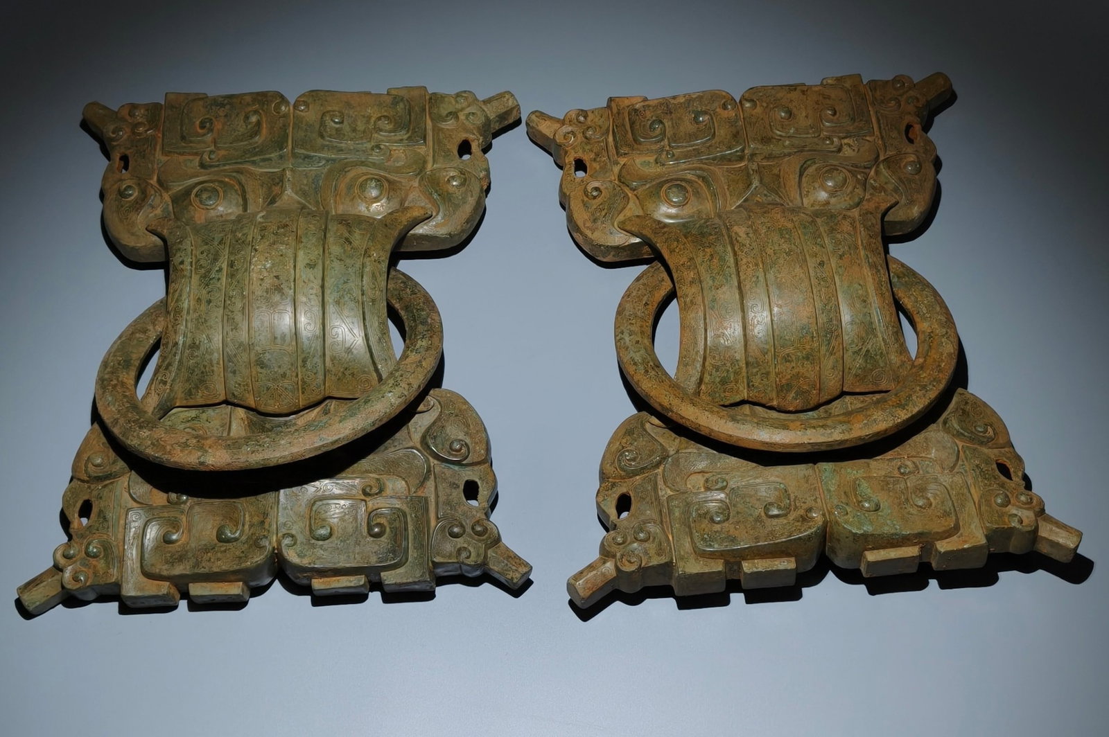 A Pair of Archaic Bronze Beast-Face Pattern Pendants: A Pair of Archaic Bronze Beast-Face Pattern Pendants,the Warring States period in China,Size:18.5inx15in 一对青铜兽面纹挂件,中国৏