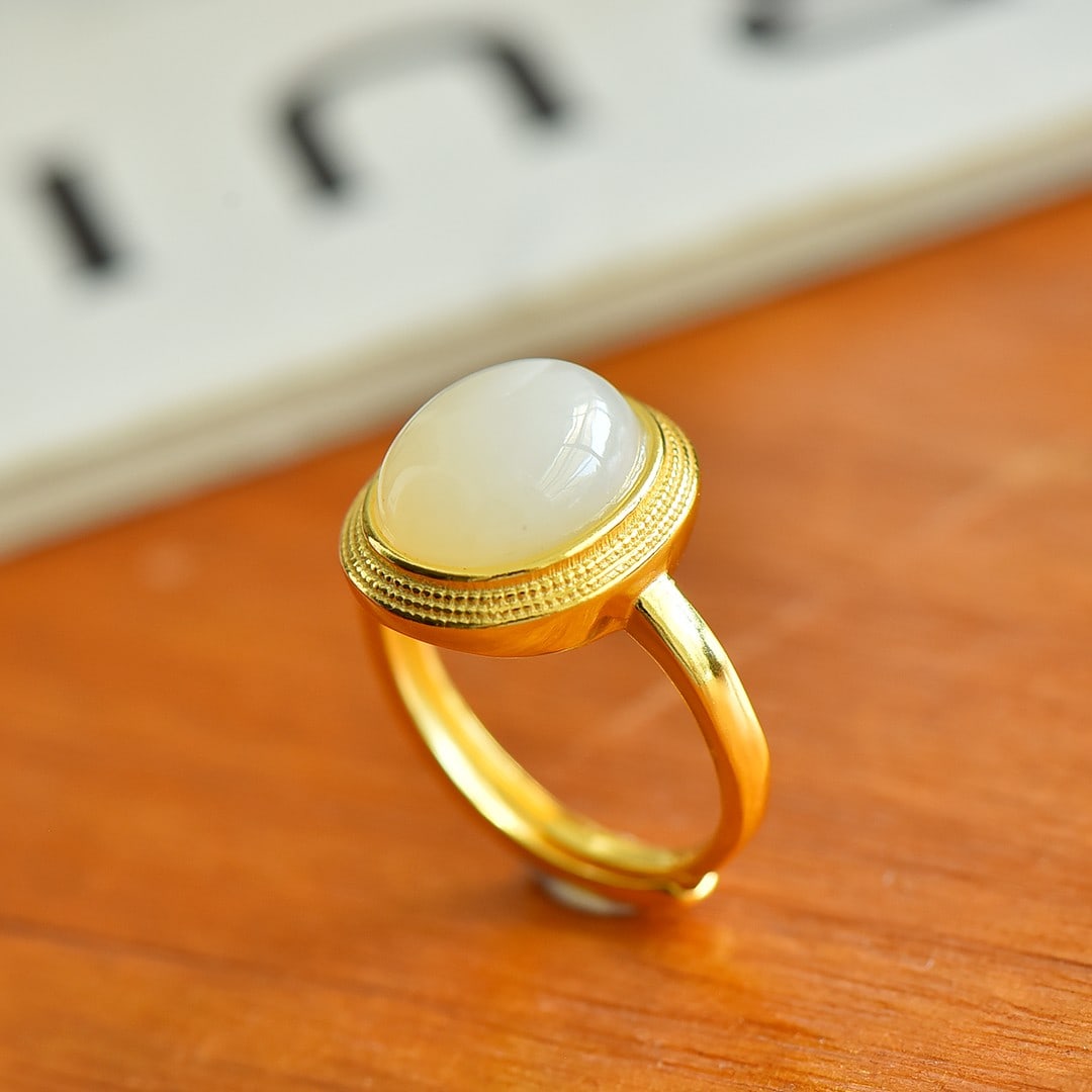 An Exquisite Sterling Silver-Gold Plated Inlaid White Jade Ring: An Exquisite Sterling Silver-Gold Plated Inlaid White Jade Ring,Size:10mmx12mm 纯银镀金镶白玉戒指