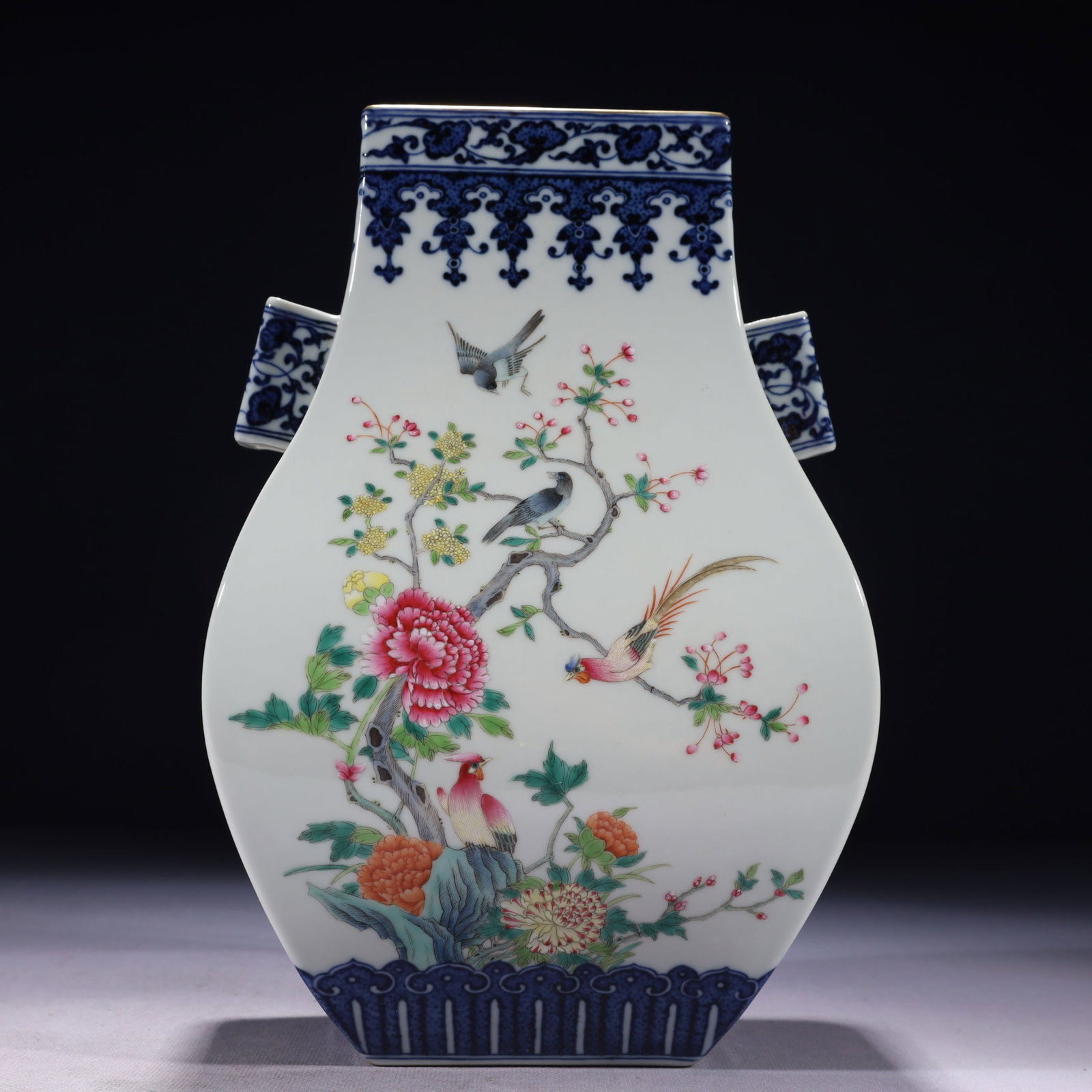 An Exquisite Blue and White Famille-Rose Painted Gold Flower and Phoenix Pattern Double-Ears Vase: An Exquisite Blue and White Famille-Rose Painted Gold Flower and Phoenix Pattern Double-Ears Vase,Qing Dynasty,China,Qianlong Six-character Mark,Size:6.7inx5.1inx10.4in,Weight:2150g 青花&#