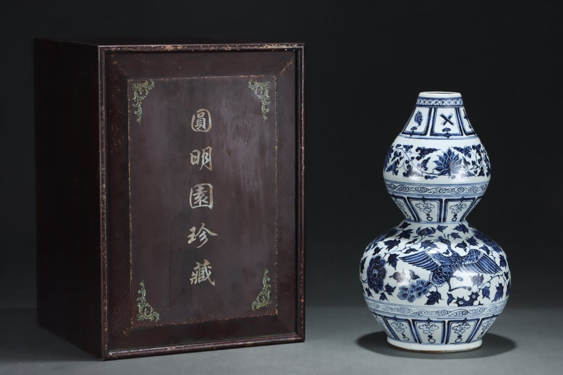 A Rare Blue and white double-gourd vase decorated with scrolling flowers and phoenix: A Rare Blue and white double-gourd vase decorated with scrolling flowers and phoenix,Yuan Dynasty, China,Size:14.1inx8.3in