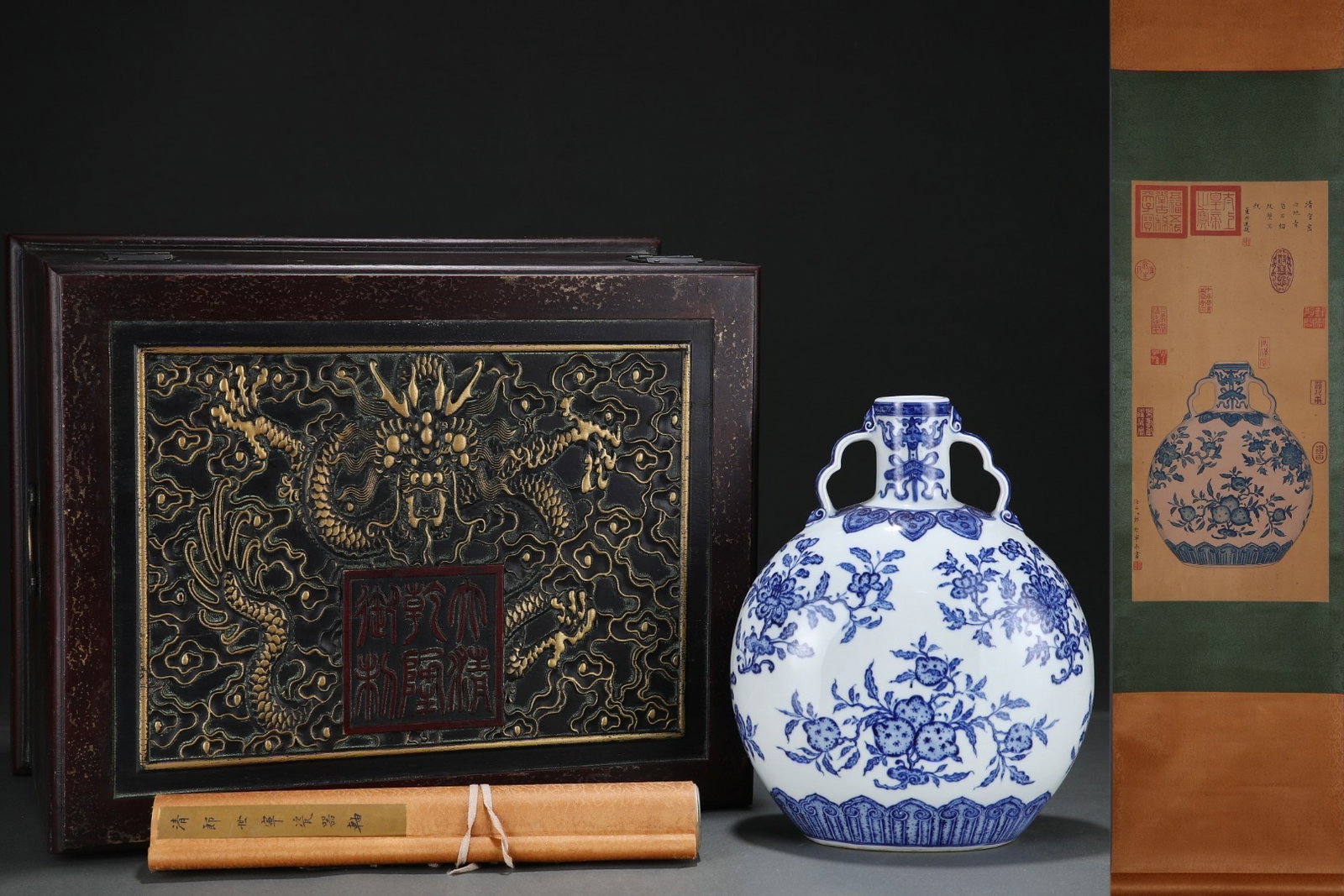 A Rare Blue and White Flower and Fruit Pattern Double-Ears Vase,With Vertical Scroll Painting on: A Rare Blue and White Flower and Fruit Pattern Double-Ears Vase,With Vertical Scroll Painting on Silk,Qing Dynasty, China,Qianlong Six-character Mark,Size:12.2inx10in,(Without frame)25.2inx11.8in &