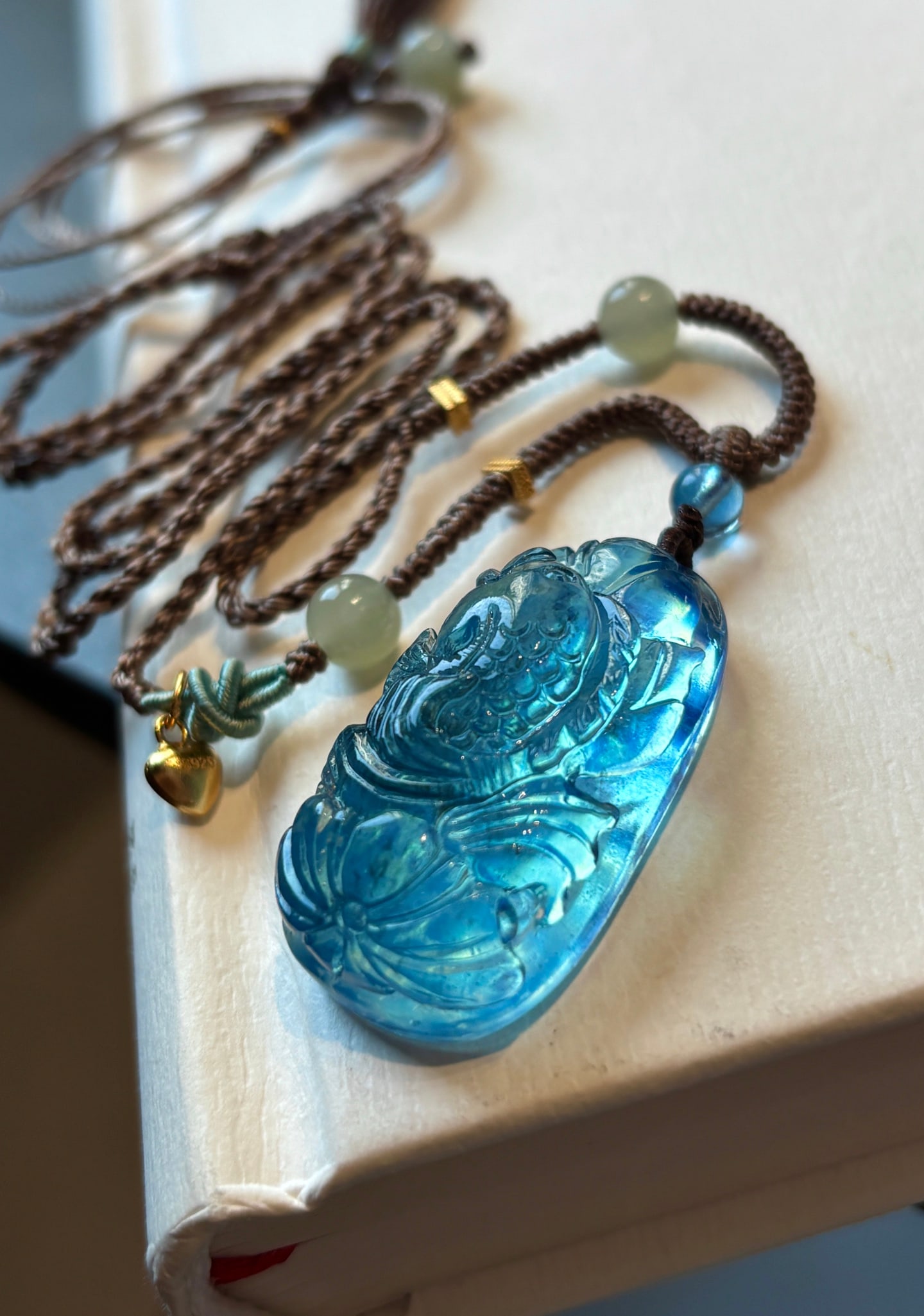 An Exquisite Aquamarine Fish Pattern Pendant: An Exquisite Aquamarine Fish Pattern Pendant,Size:34mmx18mmx12mm,Total Weight:14g 海蓝宝鱼纹吊坠