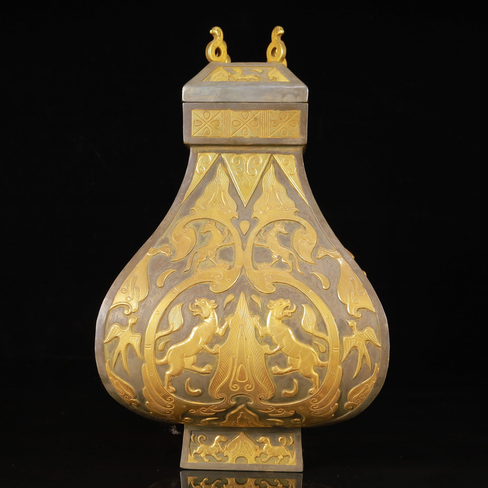 An Exquisite Gilt Silver Auspicious Beast Pattern Beast-Ears Cover Jar: An Exquisite Gilt Silver Auspicious Beast Pattern Beast-Ears Cover Jar,Tang Dynasty,China,Zhenguan Four-Character Mark,Size:7.1inx11.4in,Weight:3150g