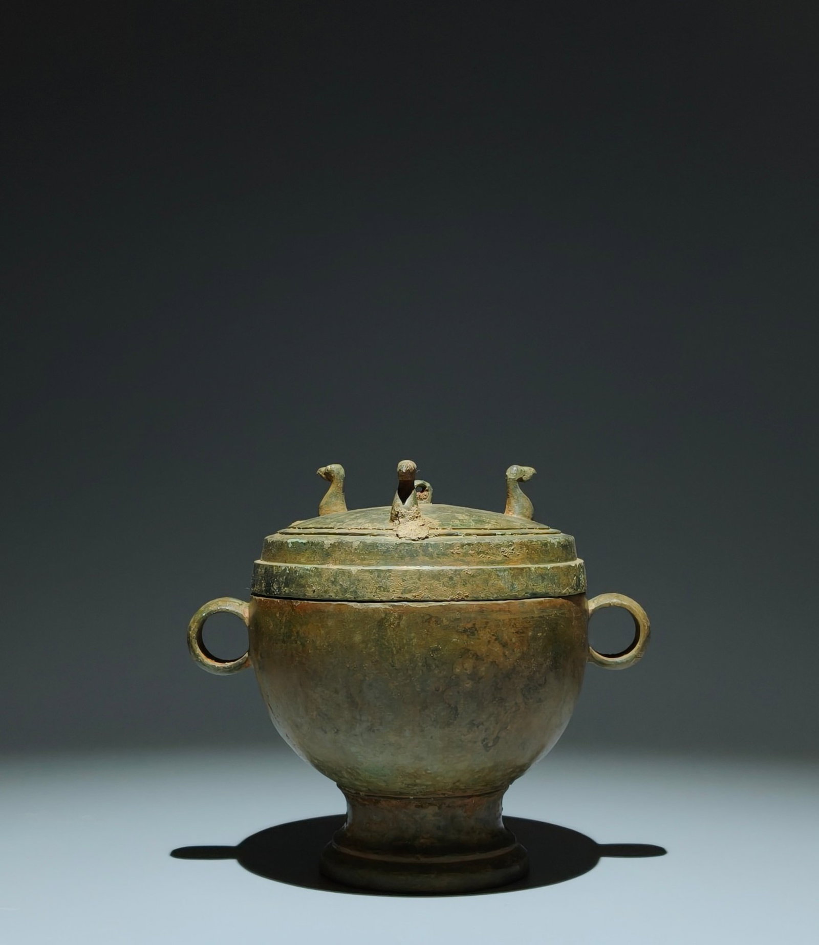 An Archaic Bronze Bird-head Double-Ears Cover Jar: An Archaic Bronze Bird-head Double-Ears Cover Jar,the Warring States period in China,Size:6.3inx7.1inx5.3in