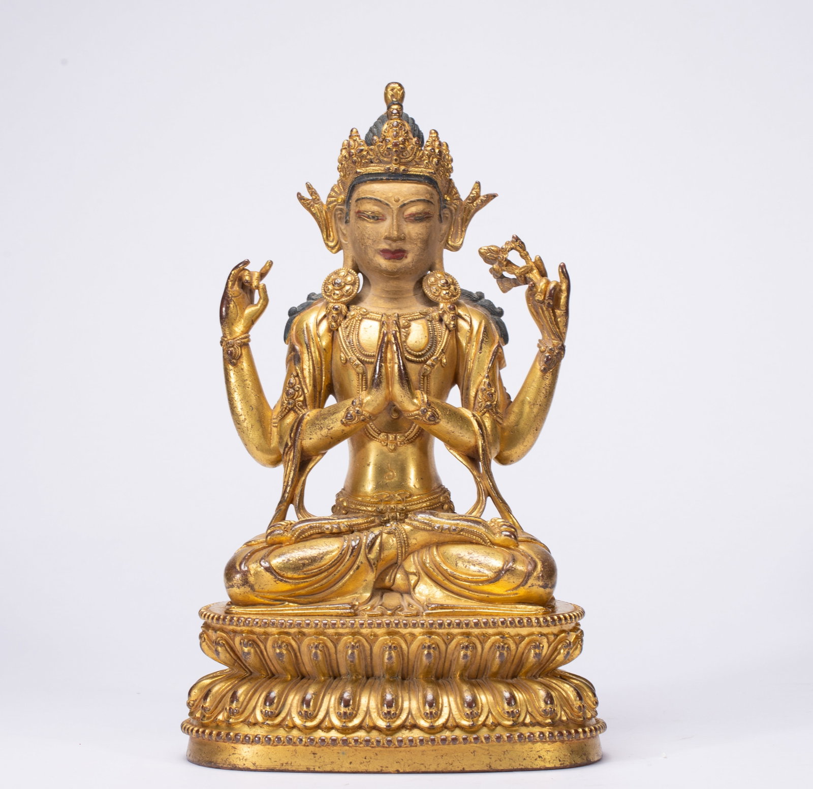 A Solemn Gilt Bronze Statue of Four-Arms Avalokitesvara: A Solemn Gilt Bronze Statue of Four-Arms Avalokitesvara,Qing Dynasty,China,Size:5.9inx4.3inx9.8in,Weight:2540g 铜鎏金四臂观音像,中国清