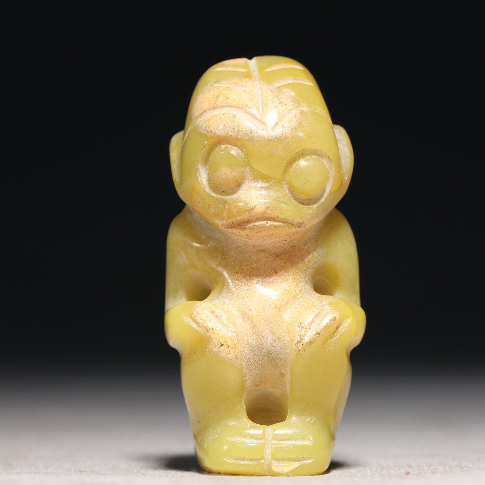 An Archaic Hongshan Culture Yellow Jade Figure Ornament: An Archaic Hongshan Culture Yellow Jade Figure Ornament,Ancient Time, China,Size:1.1inx0.8inx2.4in Weight:54.7g 红山文化黄玉人物摆件,新
