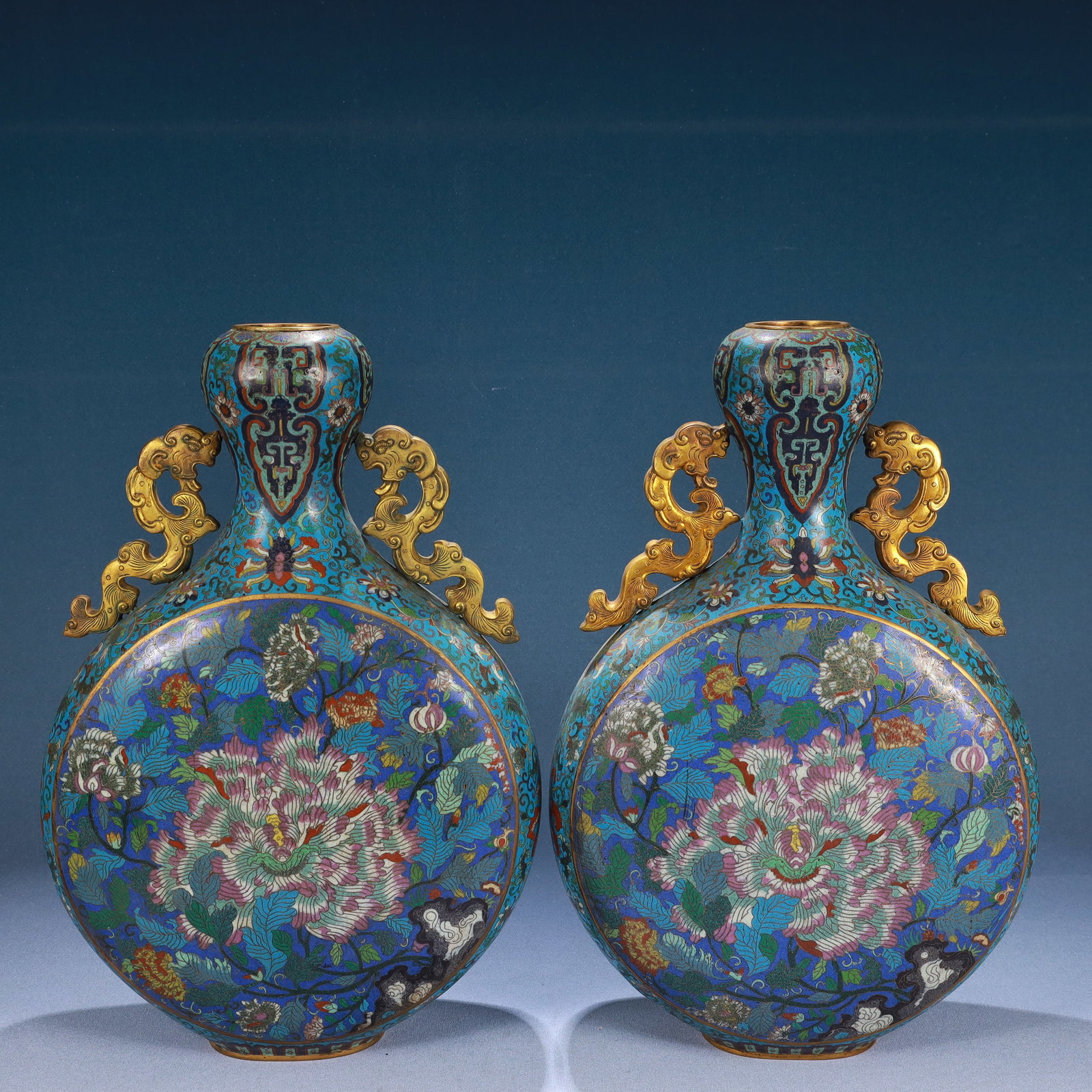 A Pair of Huge Cloisonne Flower Pattern Dragon-Ears Vases: A Pair of Huge Cloisonne Flower Pattern Dragon-Ears Vases,Qing Dynasty, China,Qianlong Four-character Mark,Size:15.9inx9.8inx3.5in,Weight:6200g 一对景泰蓝花卉