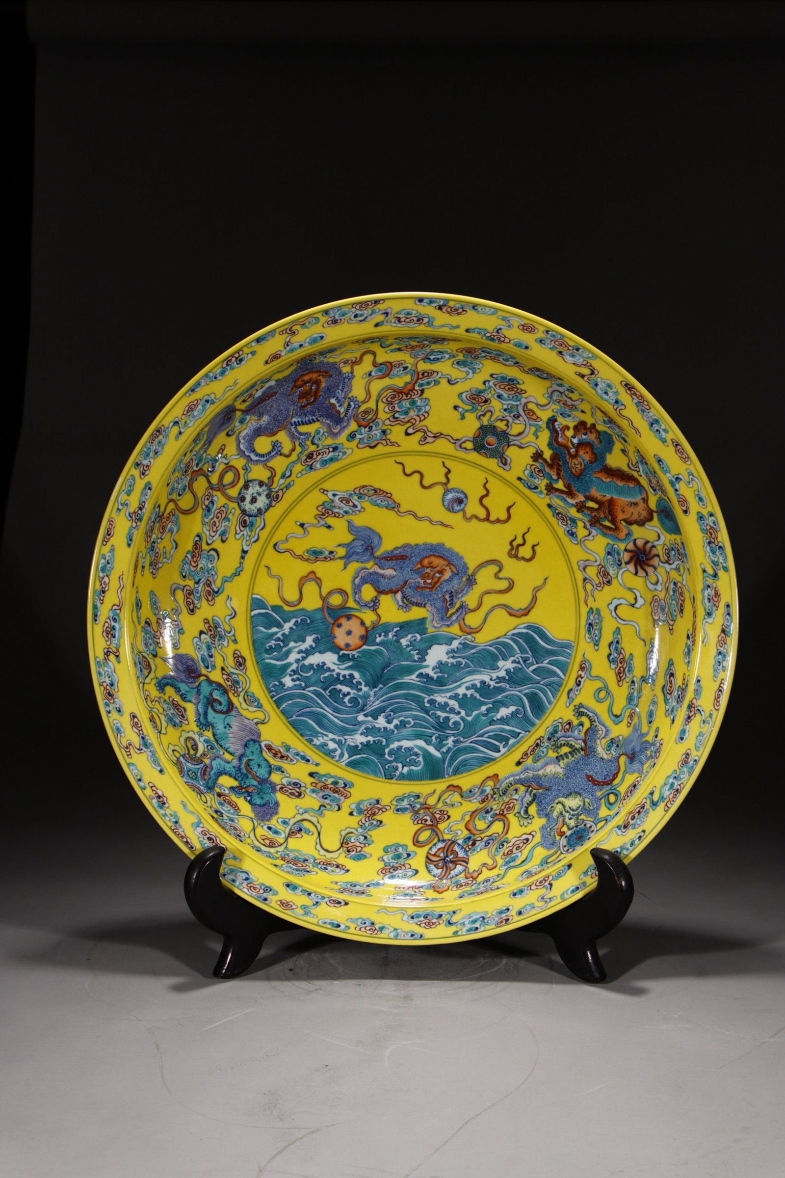 A Huge Yellow Ground Doucai Seawater and Lion Pattern Plate: A Huge Yellow Ground Doucai Seawater and Lion Pattern Plate,Qing Dynasty,China,Qianlong Six-character Mark,Size:20.7in 黄地斗彩海水狮子纹盘&