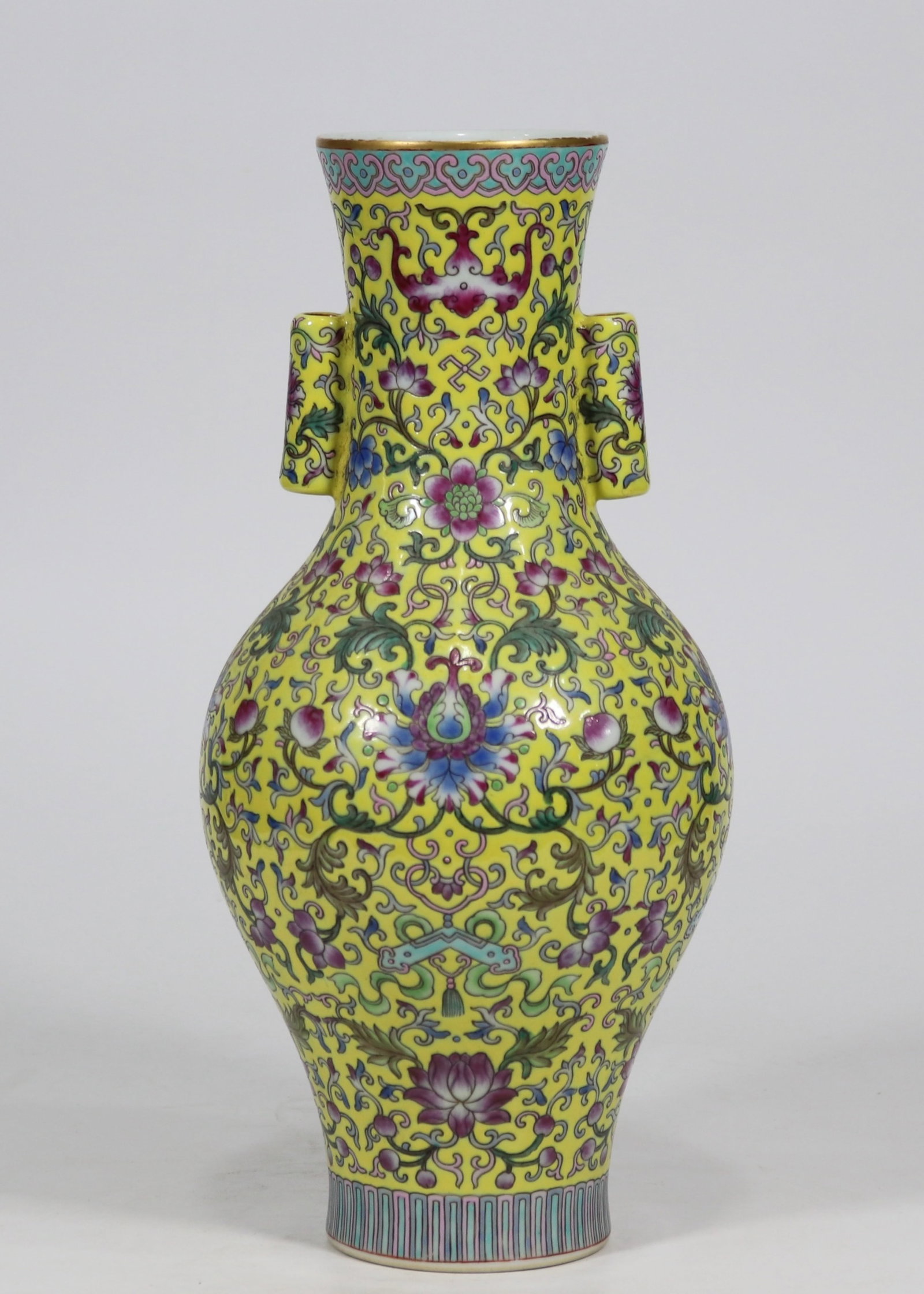 A fine yellow-ground famille rose floral olive vase with tubular handles (1 of 9)