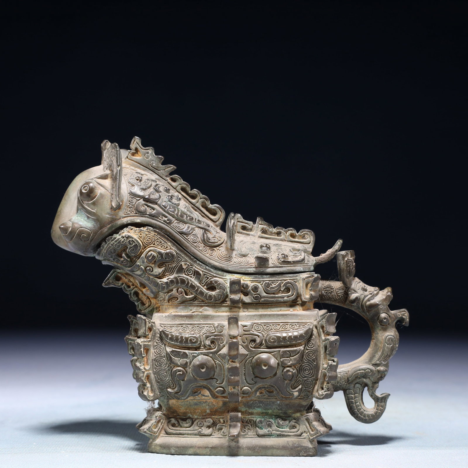 A Rare Bronze Beast-Face Pattern Wine vessel: A Rare Bronze Beast-Face Pattern Wine vessel,Shang Dynasty,China,Size:5.5inx2.4inx5.1in,Weight:600g