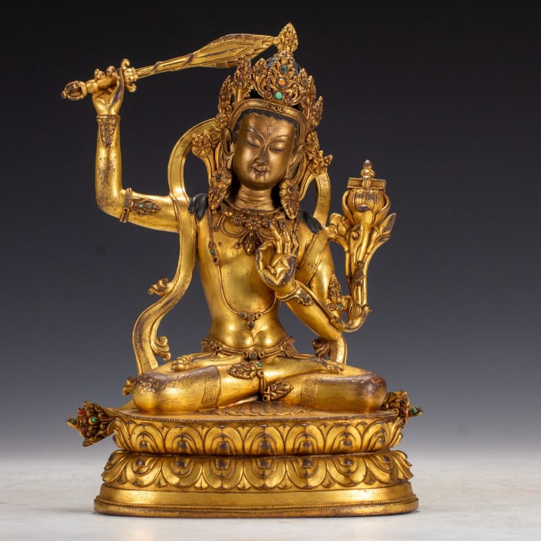 A Solemn Gilt Bronze Statue of Manjusri: A Solemn Gilt Bronze Statue of Manjusri,Qing Dynasty,China,Qianlong Mark,Size:7.1inx4.5inx10.6in,Weight:3000g