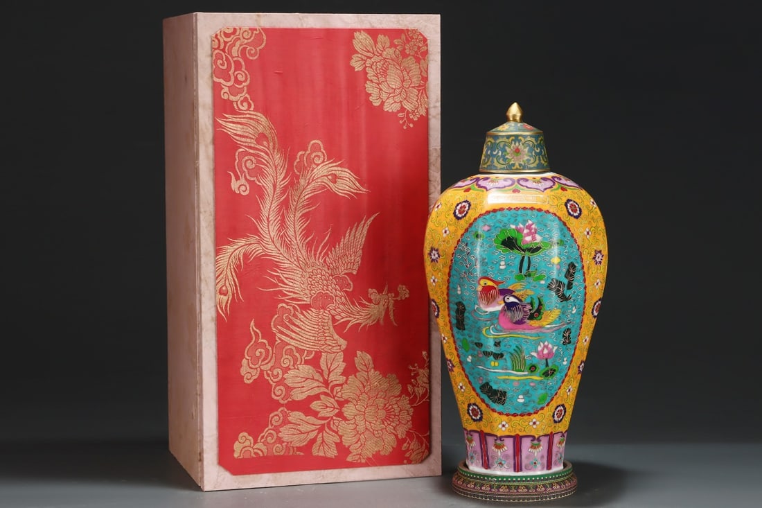 A Huge Cloisonn?? enamel yellow-ground octagonal meiping decorated with mandarin ducks in reserved: A Huge Cloisonné enamel yellow-ground octagonal meiping decorated with mandarin ducks in reserved panels amidst passion flowers,Ming Dynasty, China,Size:20.1inx10.4in