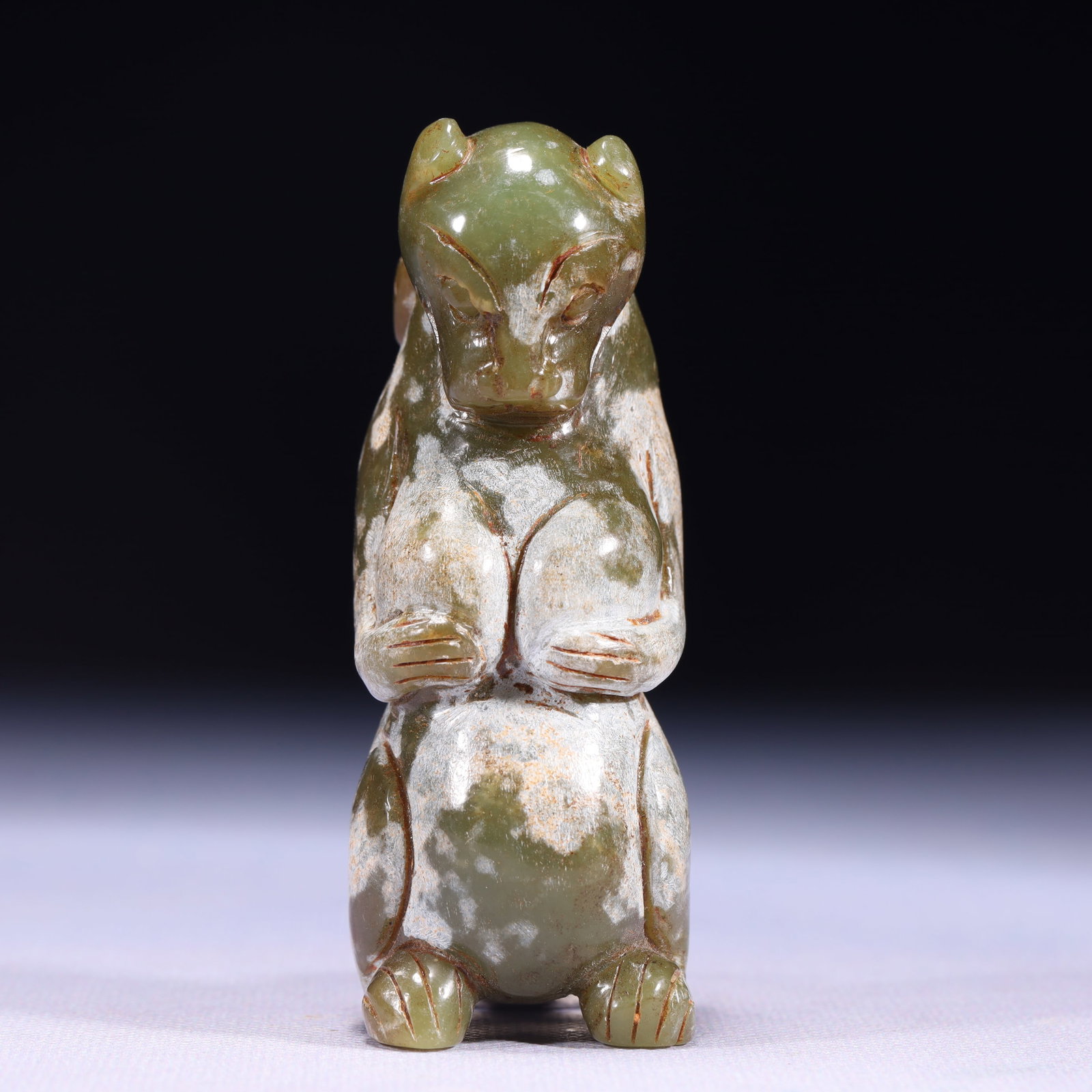 An Exquisite Green Jade Bear Ornament: An Exquisite Green Jade Bear Ornament,Qing Dynasty,China,Size:1.4inx1.2inx3.5in,Weight:232g 青玉熊摆件,中国清代